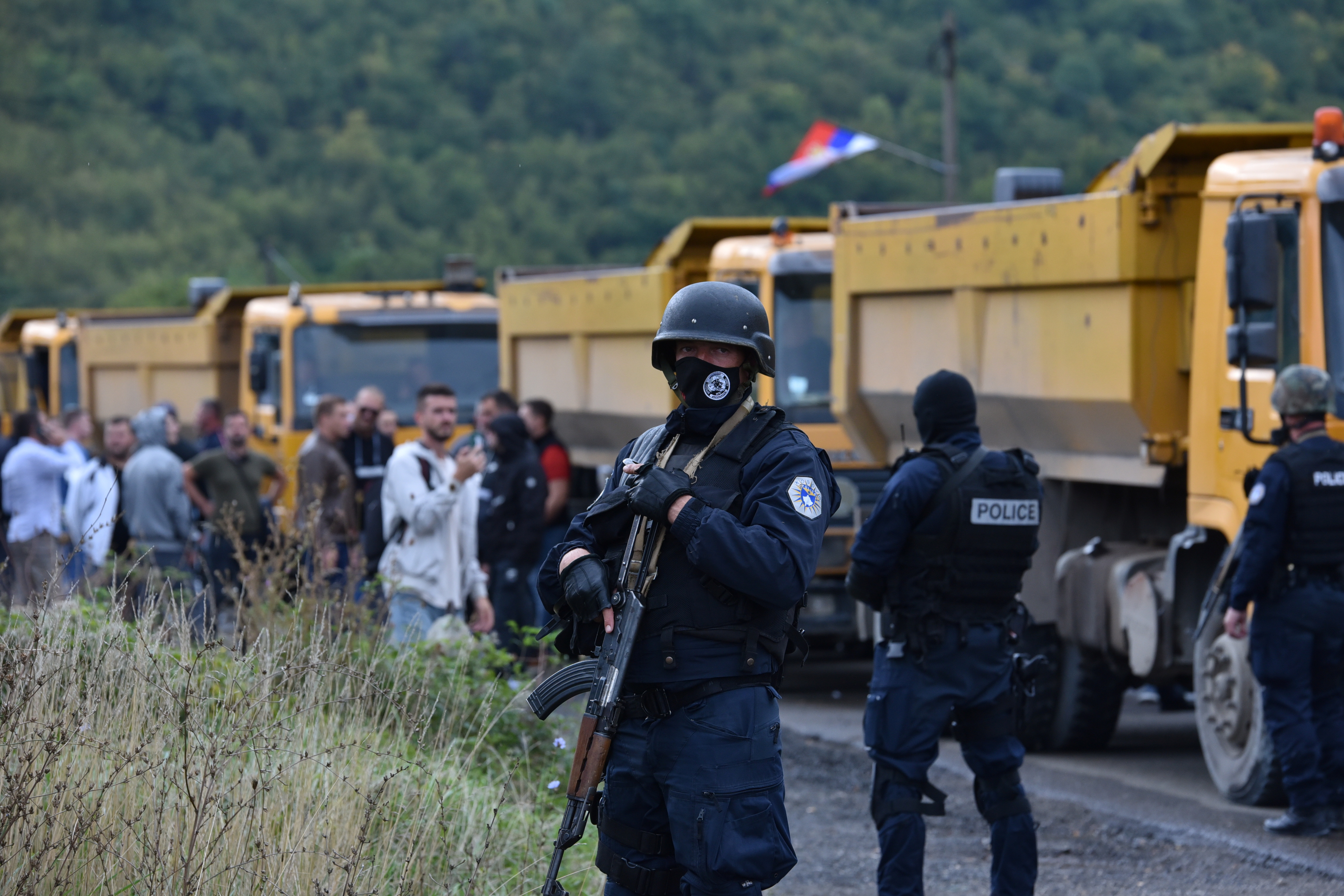 Kosovo special police stands as hundreds of Kosovo Serbs protest against a government ban on entry of vehicles with Serbian registration plates in Jarinje, Kosovo