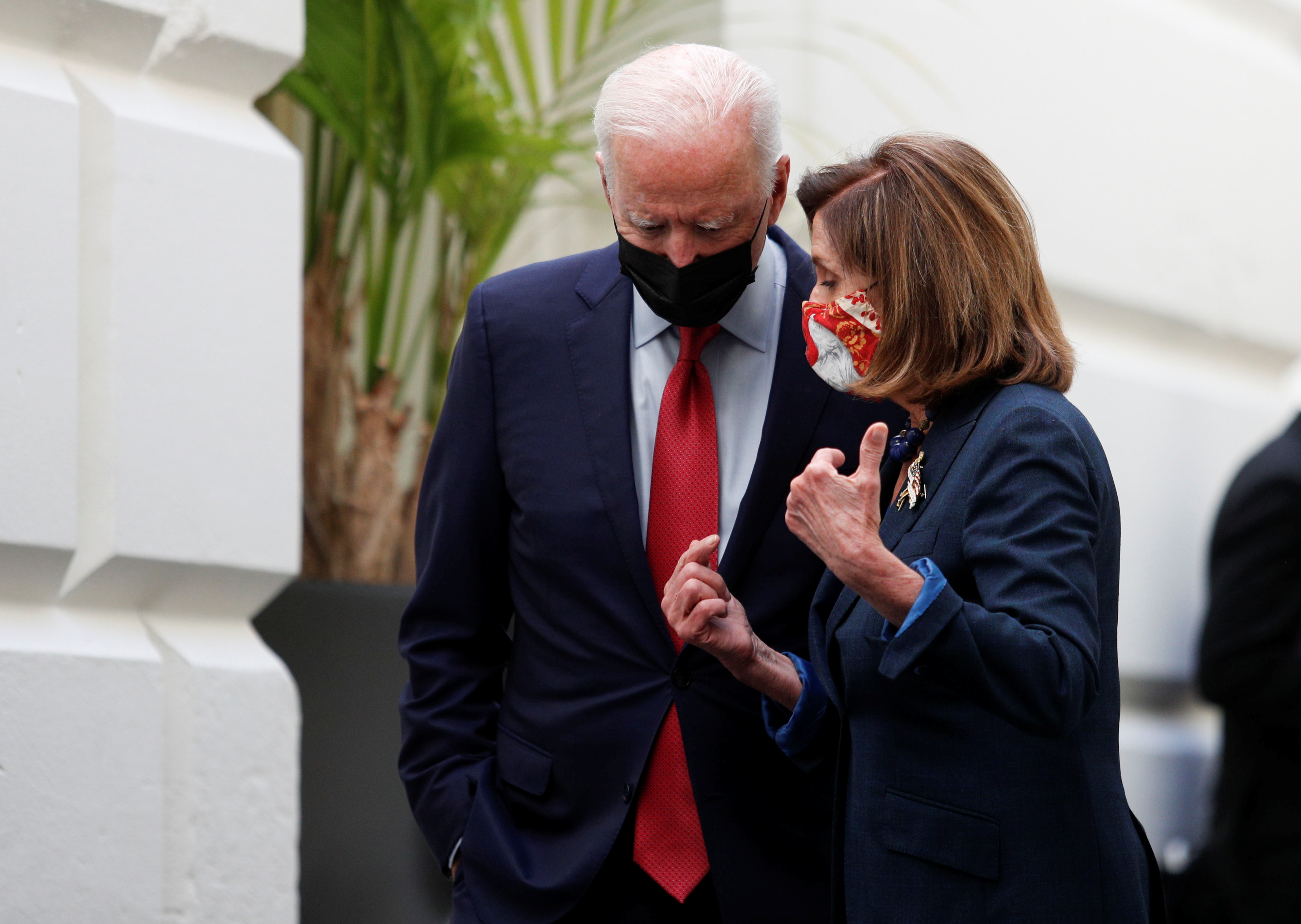 U.S. President Joe Biden talks with Speaker of the House Nancy Pelosi