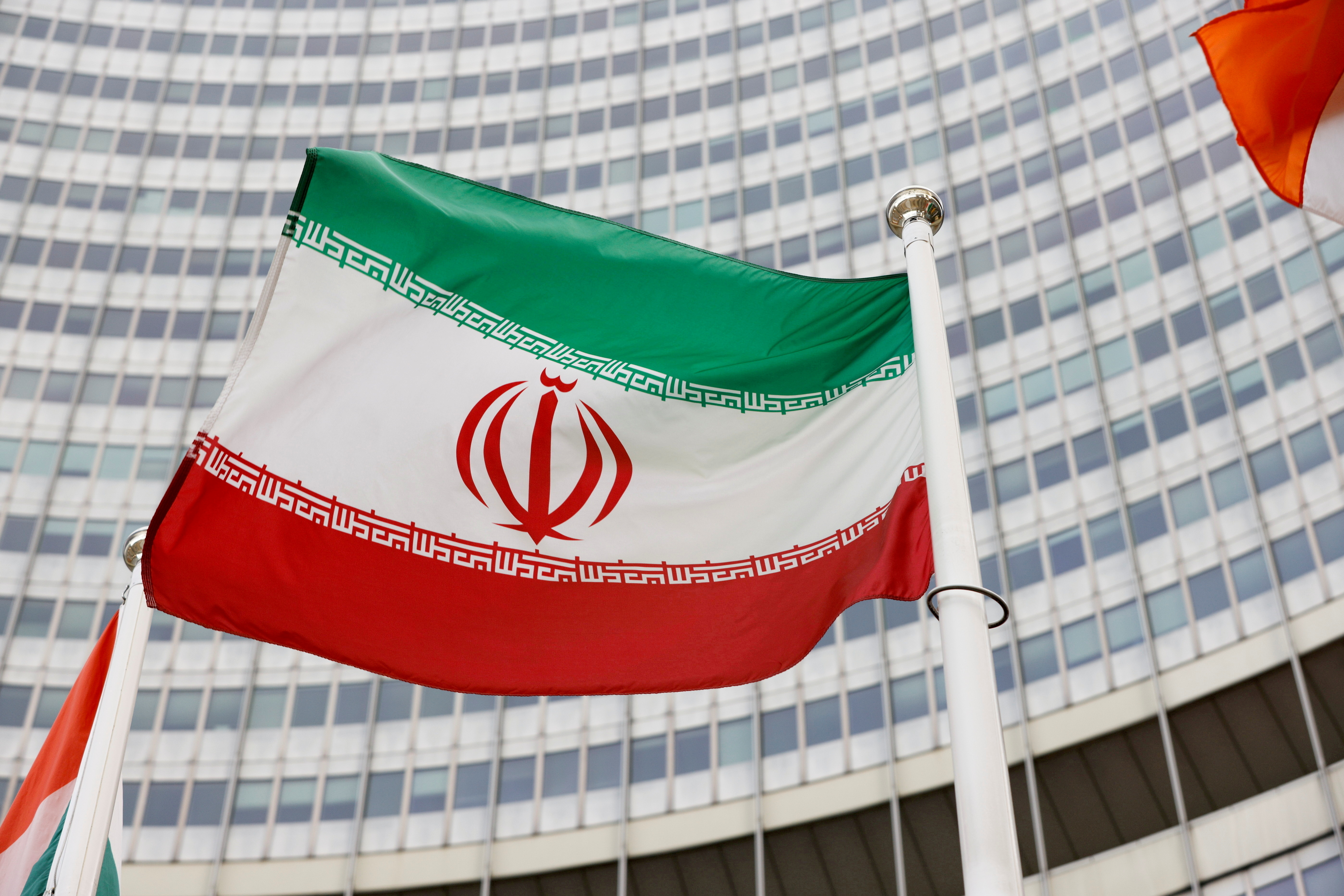 The Iranian flag waves.