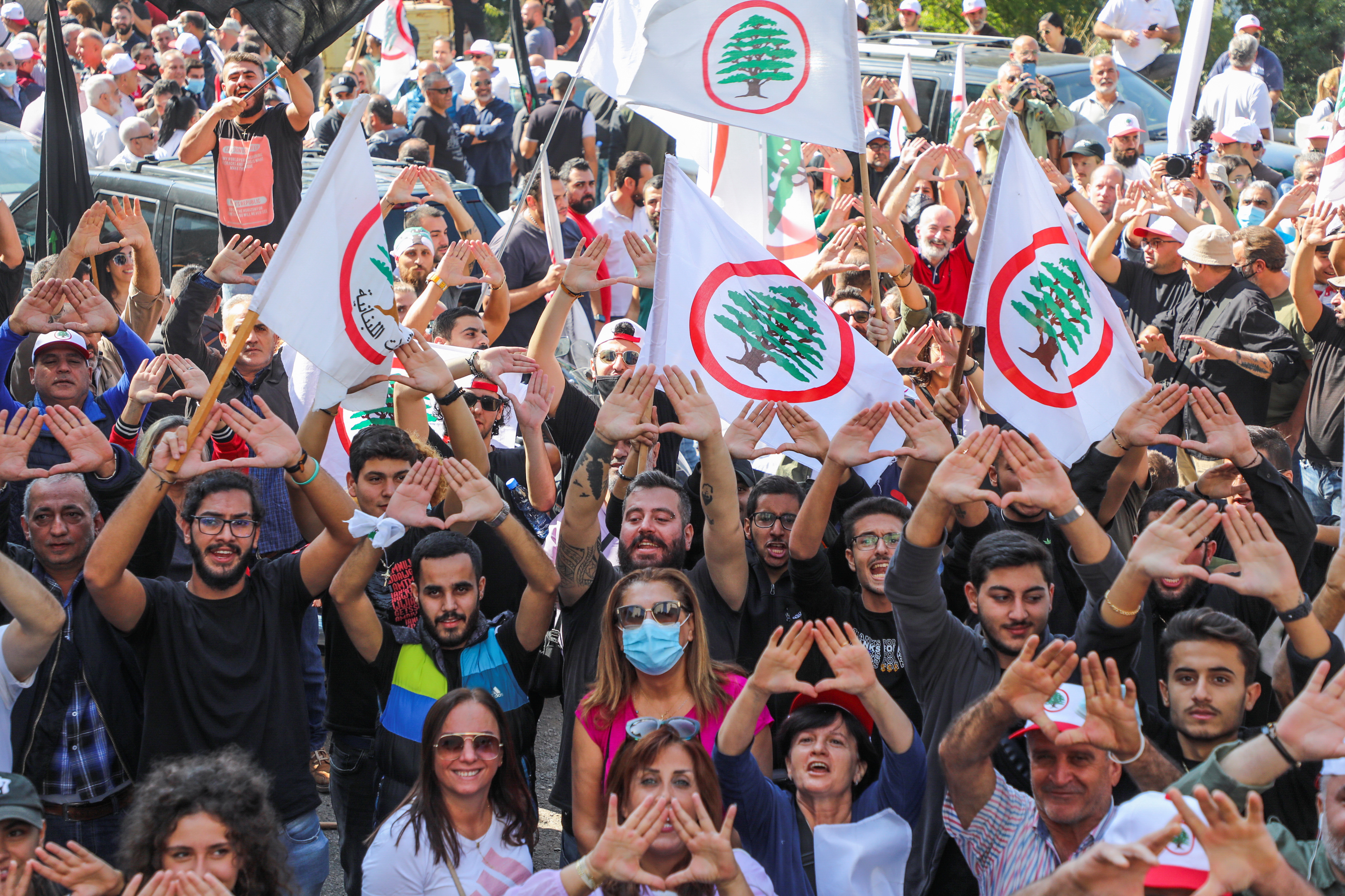 Supporters of the Christian Lebanese Forces party gesture