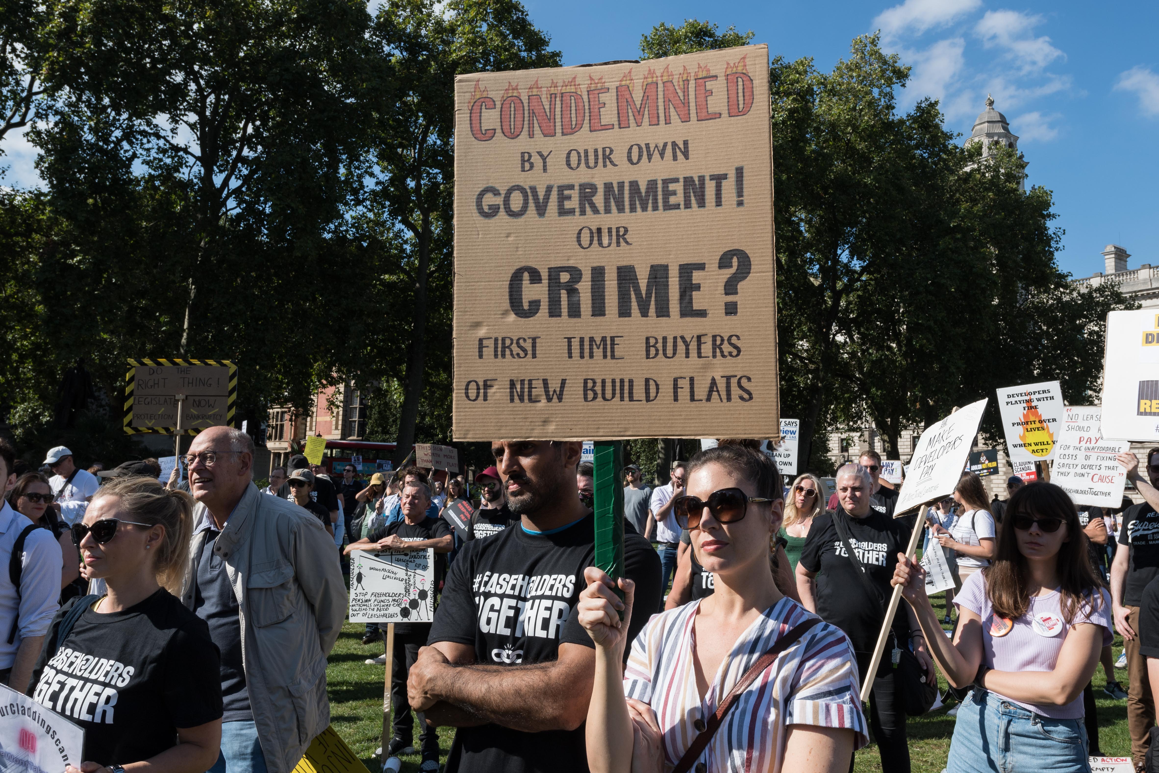Members of leasehold action groups stage a rally in Parliament Square against the cost of ground rents, building safety, cladding and call for abolition of leasehold law across England and Wales on September 16 in London [Wiktor Szymanowicz/Barcroft Media via Getty Images]