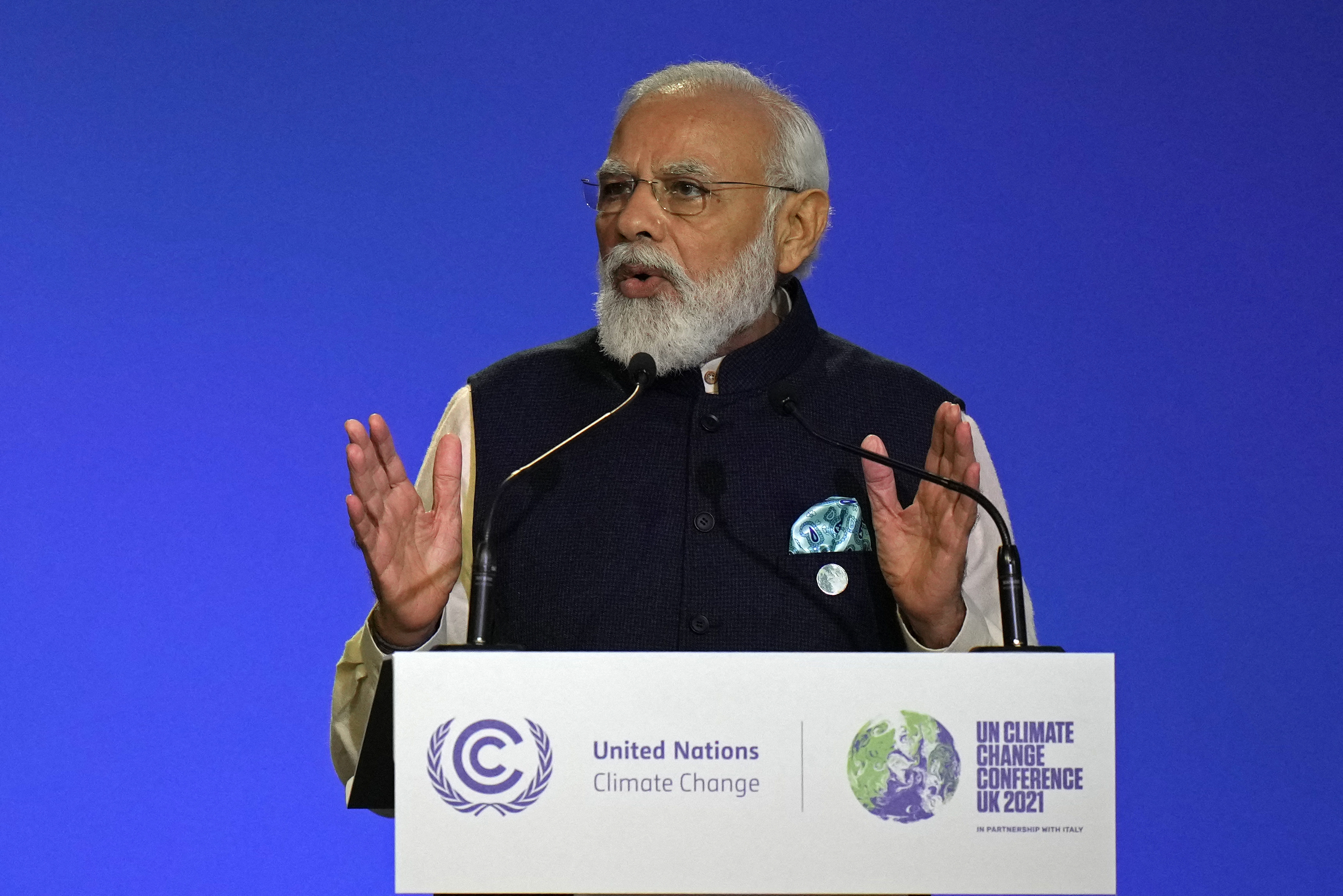 After refusing to set targets for net-zero carbon emissions, India’s Prime Minister Narendra Modi took to the stage at the United Nations Climate Change Conference in Glasgow, Scotland last week and said his country would turn net zero by 2070 [File: Alastair Grant / POOL / AFP]