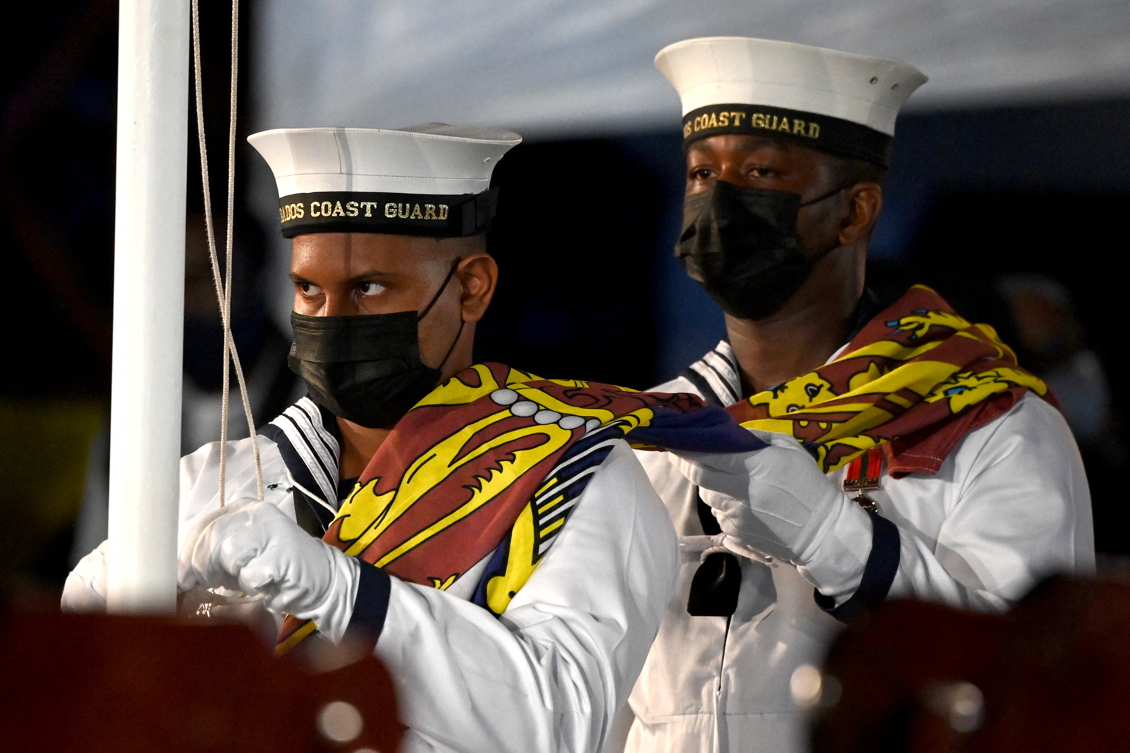 Barbados Coast Guard remove The Queen’s Royal Standard flag at the Presidential Inauguration Ceremony at Heroes Square in Bridgetown as Barbados officially became a republic [Jeff J Mitchell/Getty Images via AFP)