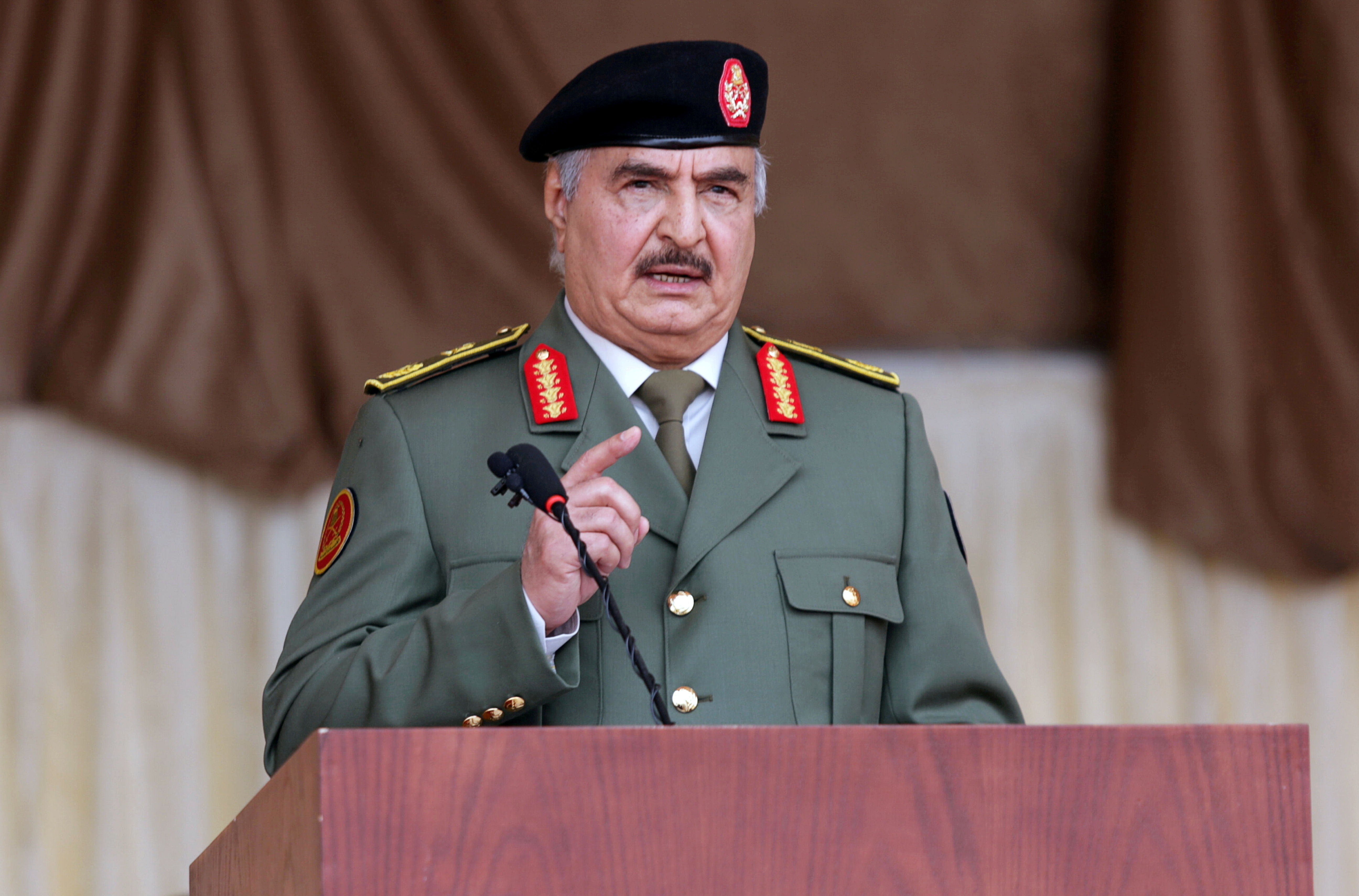 FILE PHOTO: Libyan military commander Khalifa Haftar gestures as he speaks in Benghazi, Libya December 24, 2020. REUTERS/Esam Omran Al-Fetori/File Photo