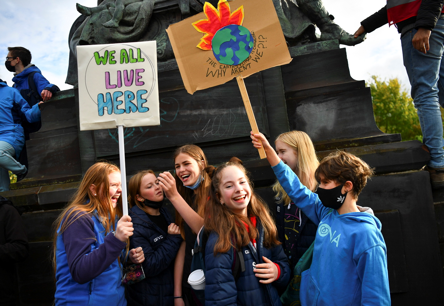 Youth holding placards attend the Fridays for Future march during the UN Climate Change Conference (COP26), in Glasgow, Scotland, Britain, November 5, 2021. REUTERS/Dylan Martinez