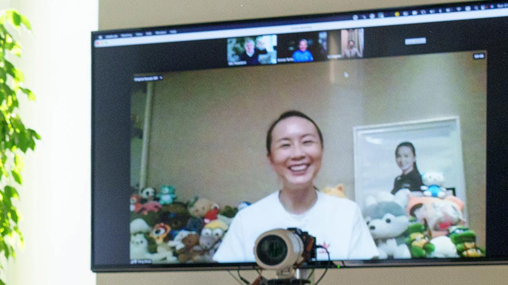 A handout photo made available by the International Olympic Committee (IOC) website shows a video call with Chinese tennis star Peng Shuai on 21 November 2021.