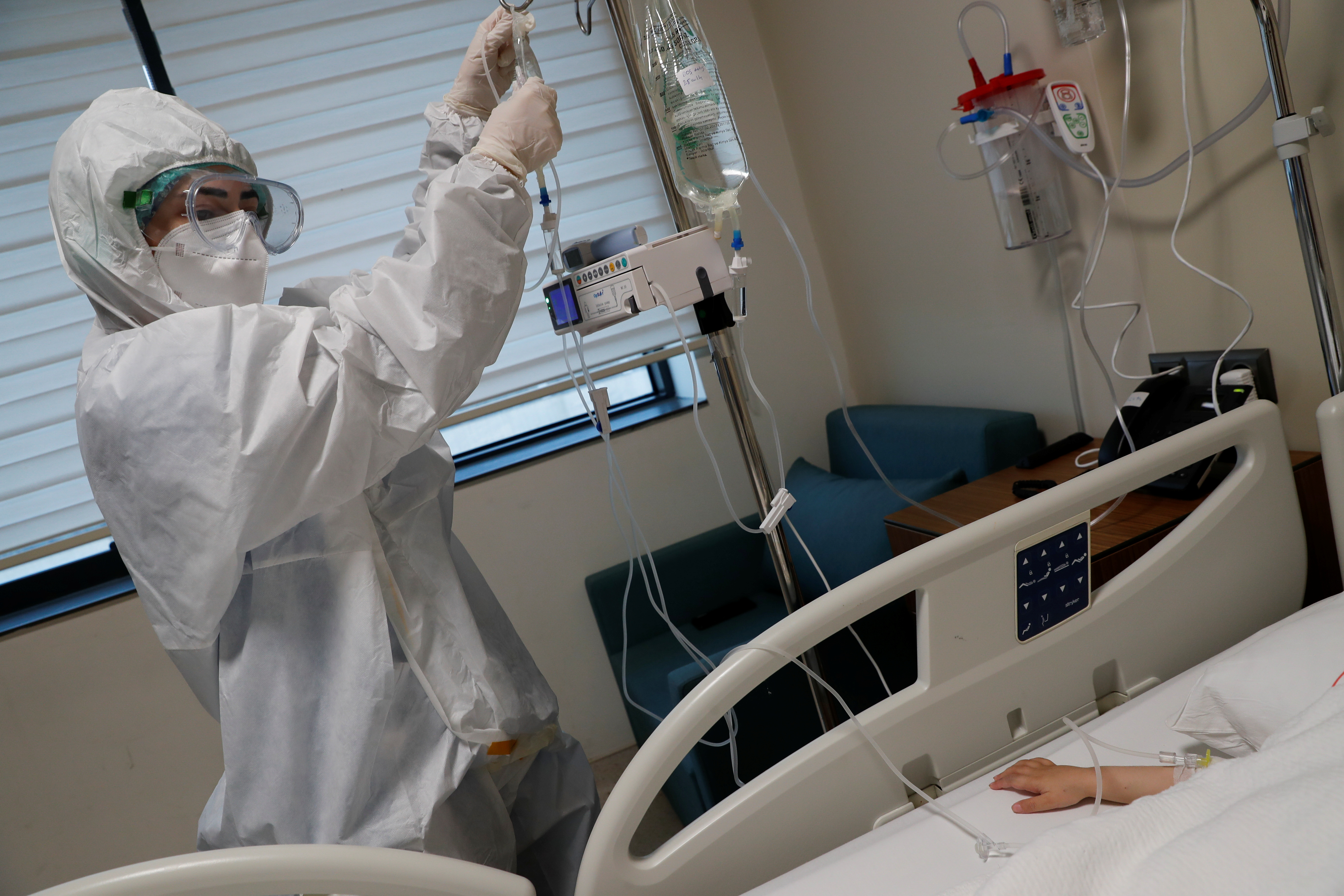 Nurse Ayse Ozdemir Peksert treats a five-year-old boy suffering from the coronavirus disease (COVID-19) at the Basaksehir Cam and Sakura City Hospital in Istanbul