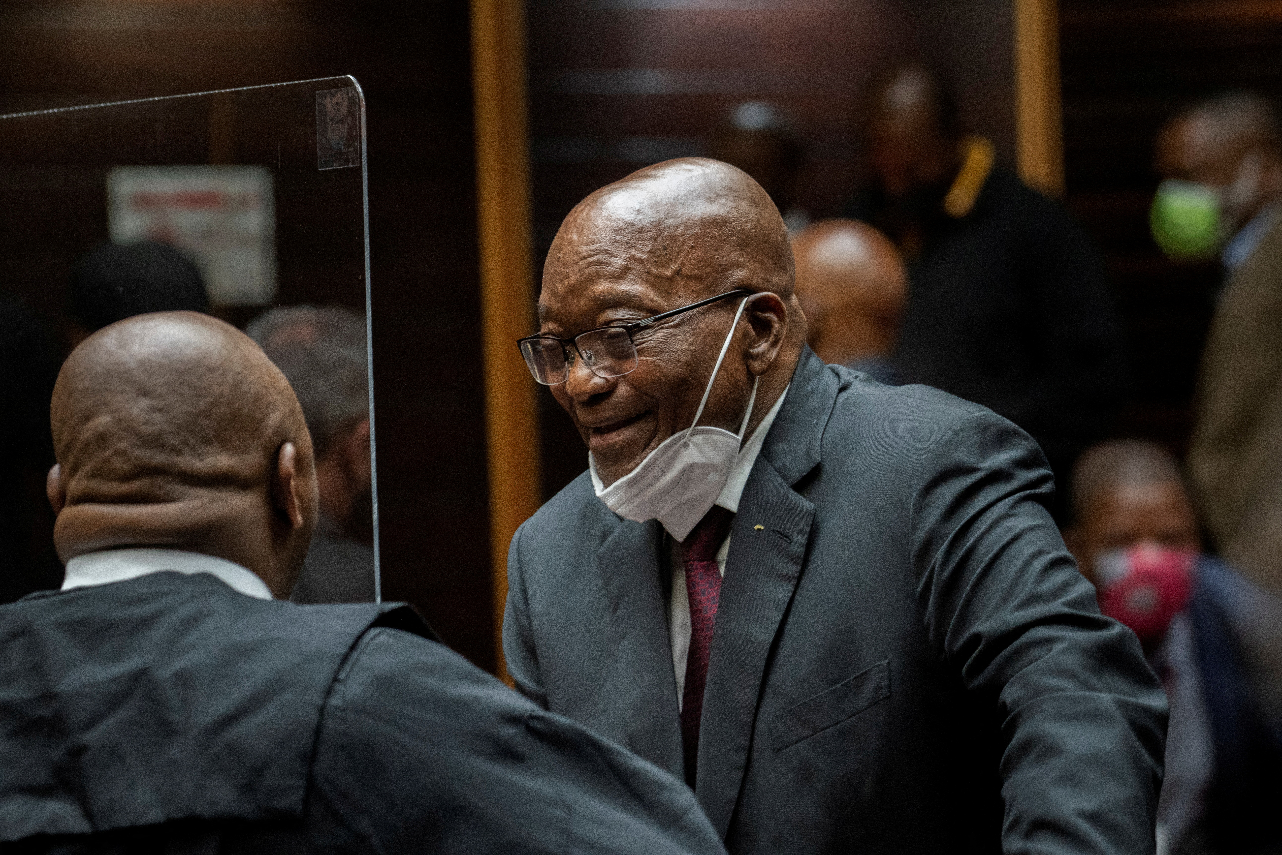 Zuma speaks with his legal counsel during his corruption trial in Pietermaritzburg [File: Jerome Delay/Pool via Reuters]
