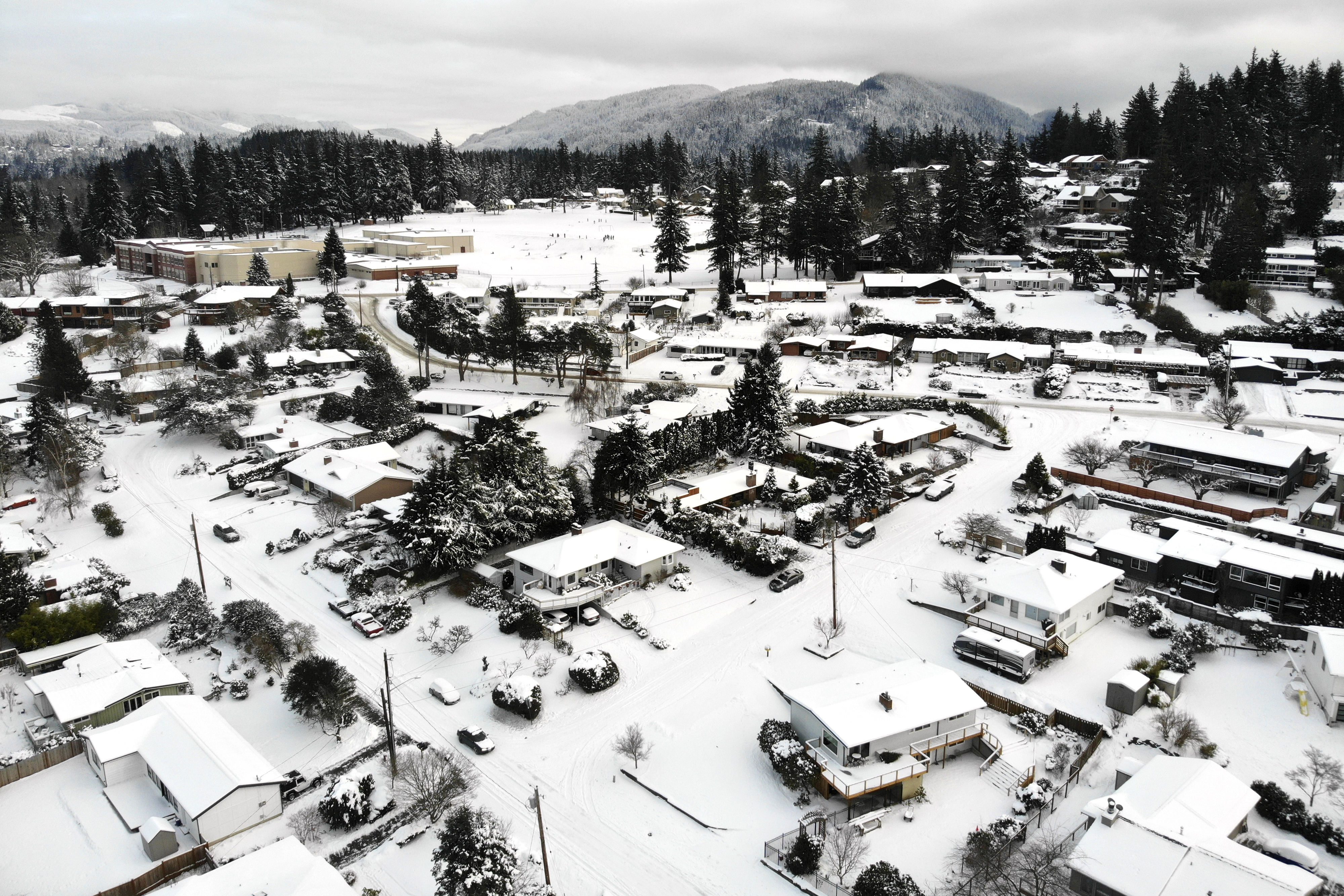 Snow covers streets, sidewalks and homes where nearly a foot of snow fell over December 25-26 in Bellingham Washington state, US