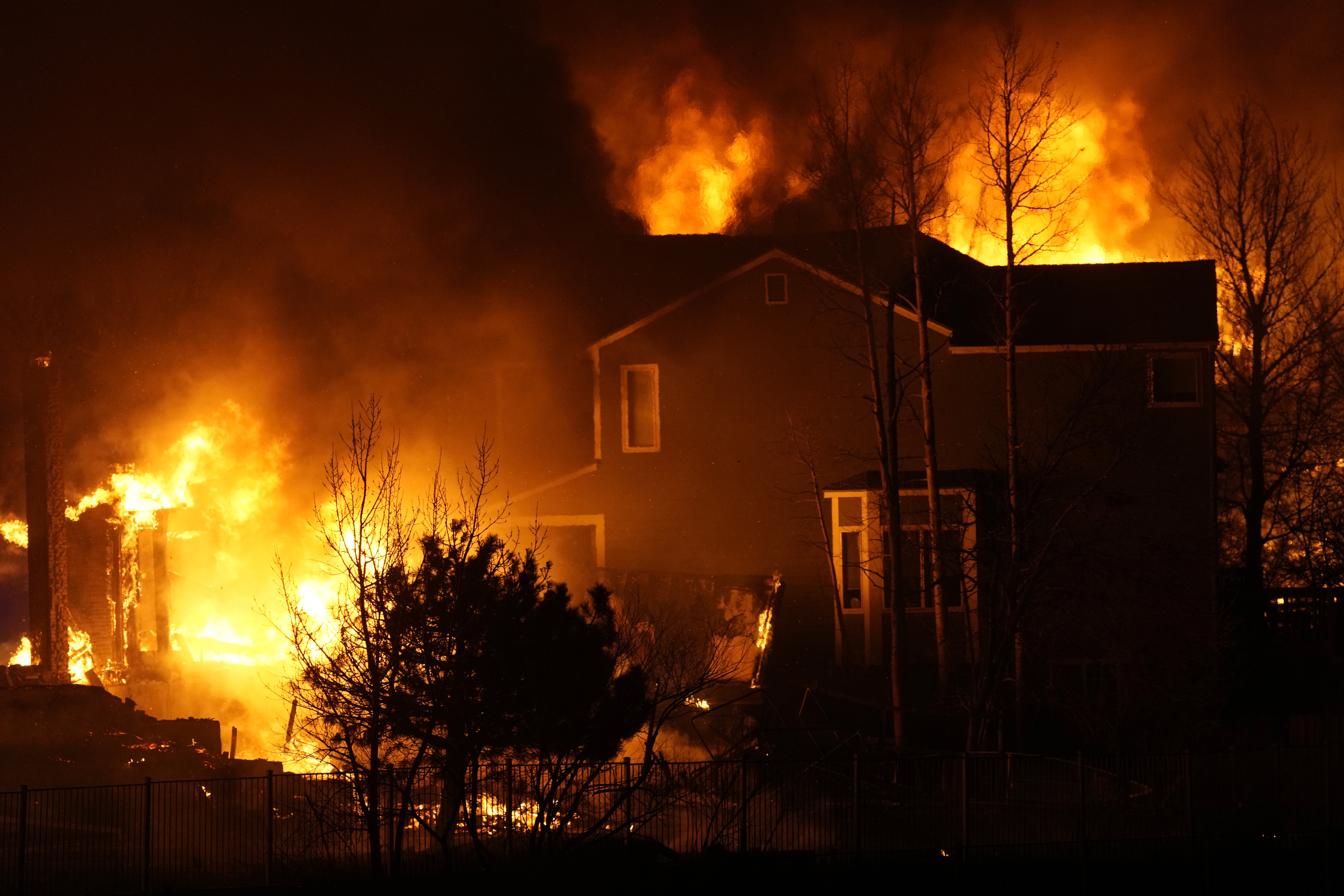 Homes burn as wildfires rip through a development in Superior, Colorado
