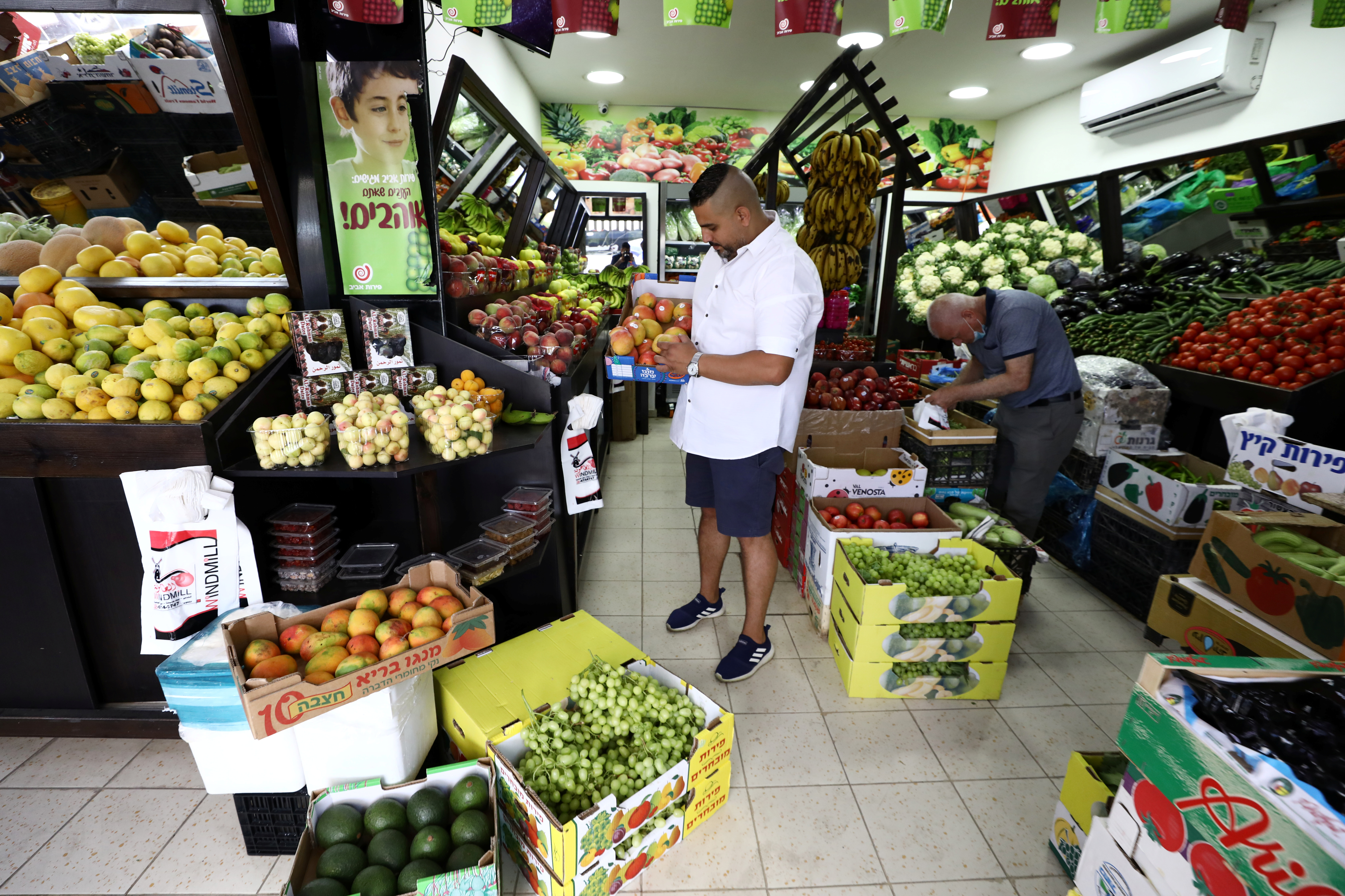 Palestinians on fixed incomes are seeing are struggling to keep food on the table as prices for essentials like meat, sugar and rice soar this year [File: Ammar Awad/Reuters]