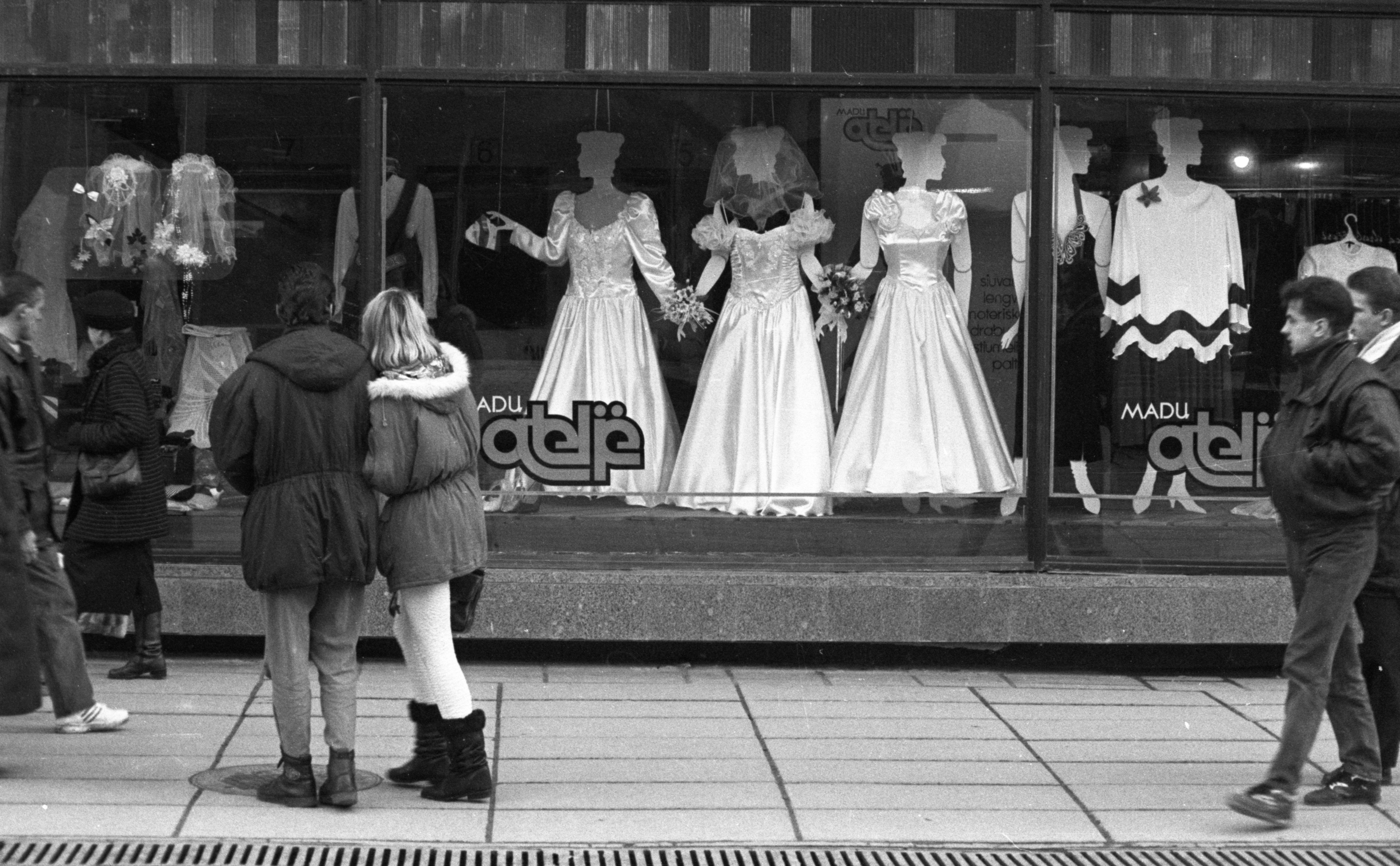 The Last Soviet Generation had to build their adult lives when the world around them was collapsing. Here, people pass a retail store in the main avenue Laisves Aleja of Kaunas town in Lithuania in 1994 [Courtesy of Paulius Lileikis]