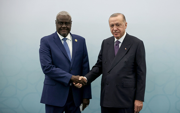 Turkish President Recep Tayyip Erdogan, right, welcomes African Union Commission chairman Moussa Faki Mahamat, left, during the Third Turkey-Africa Partnership Summit in Istanbul, Turkey [Emrah Yorulmaz/Anadolu Agency via Getty Images]