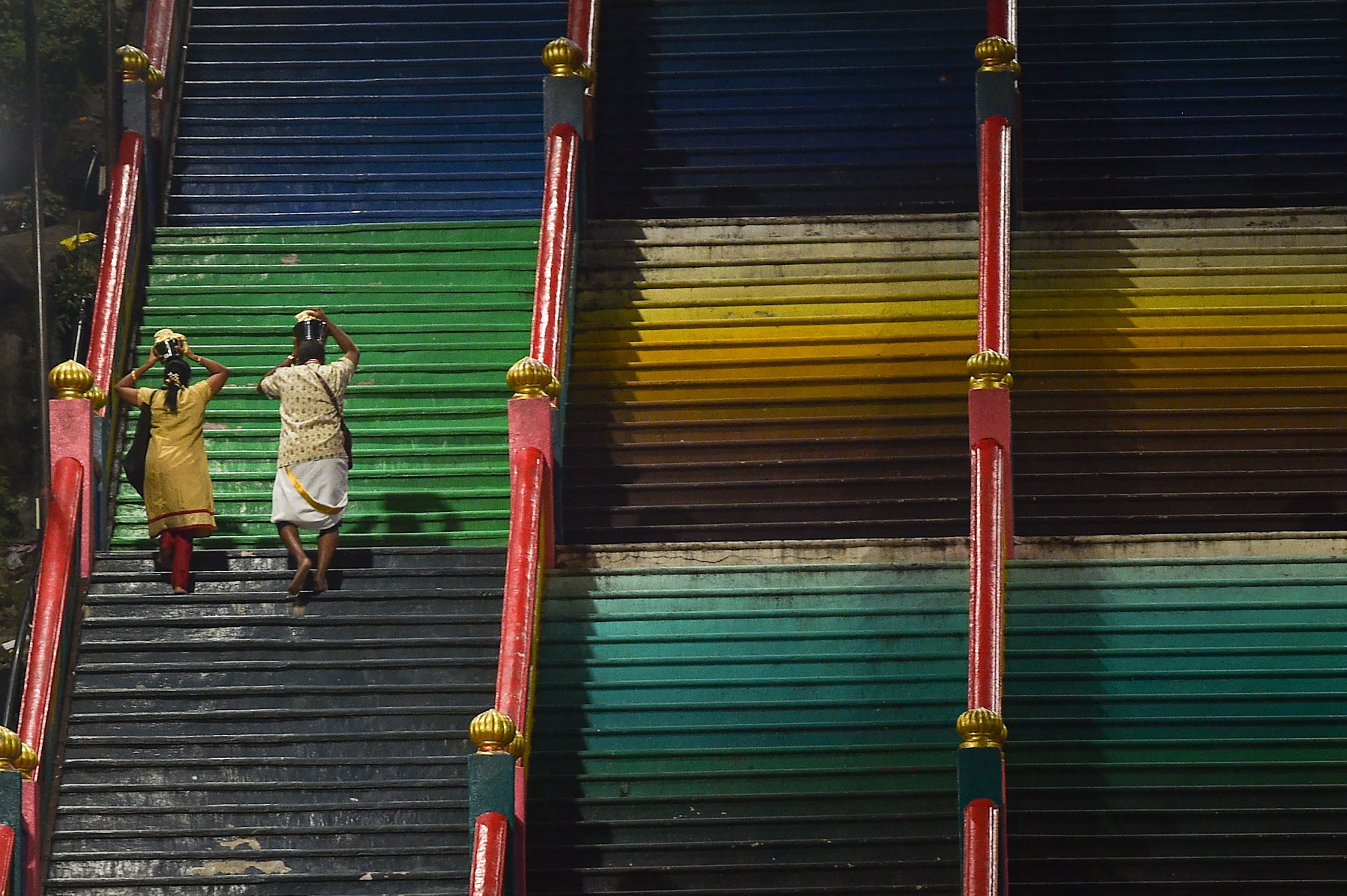 Hindu devotees carry "Paal Kudam" (milk pots) as part of the Thaipusam festival in Kuala Lumpur. 