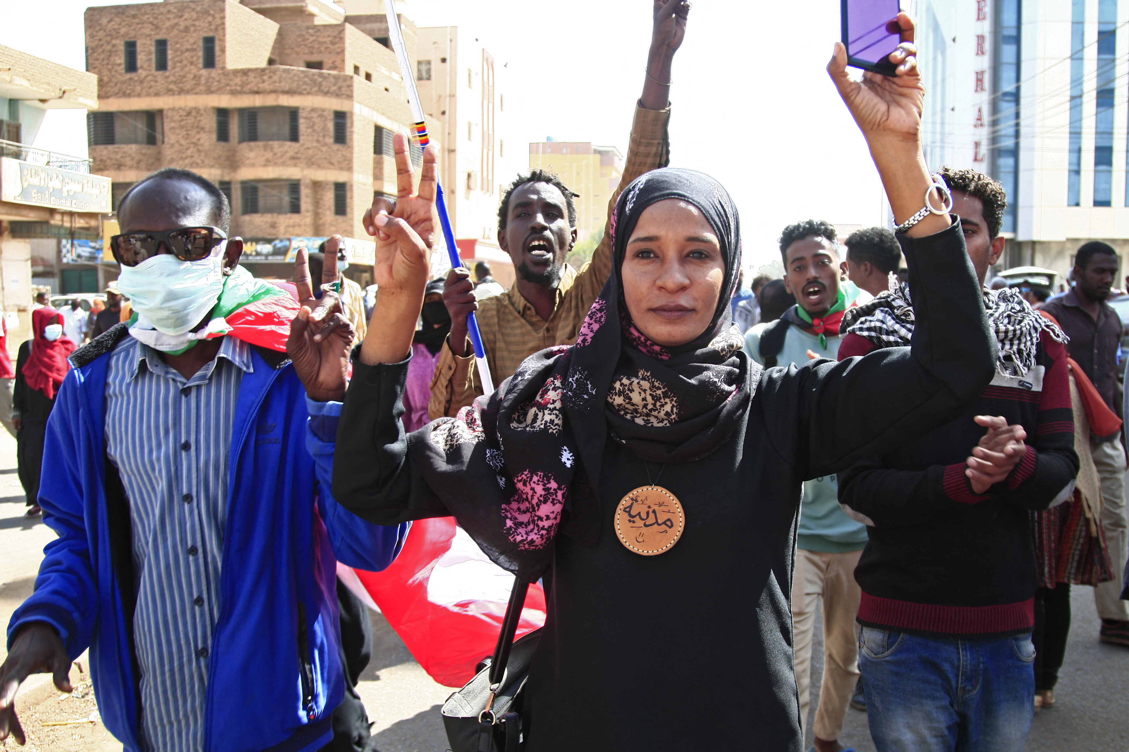 Sudanese are seen during arally against a military coup which occurred nearly three months ago, south of the capital Khartoum, on January 17, 2022. 