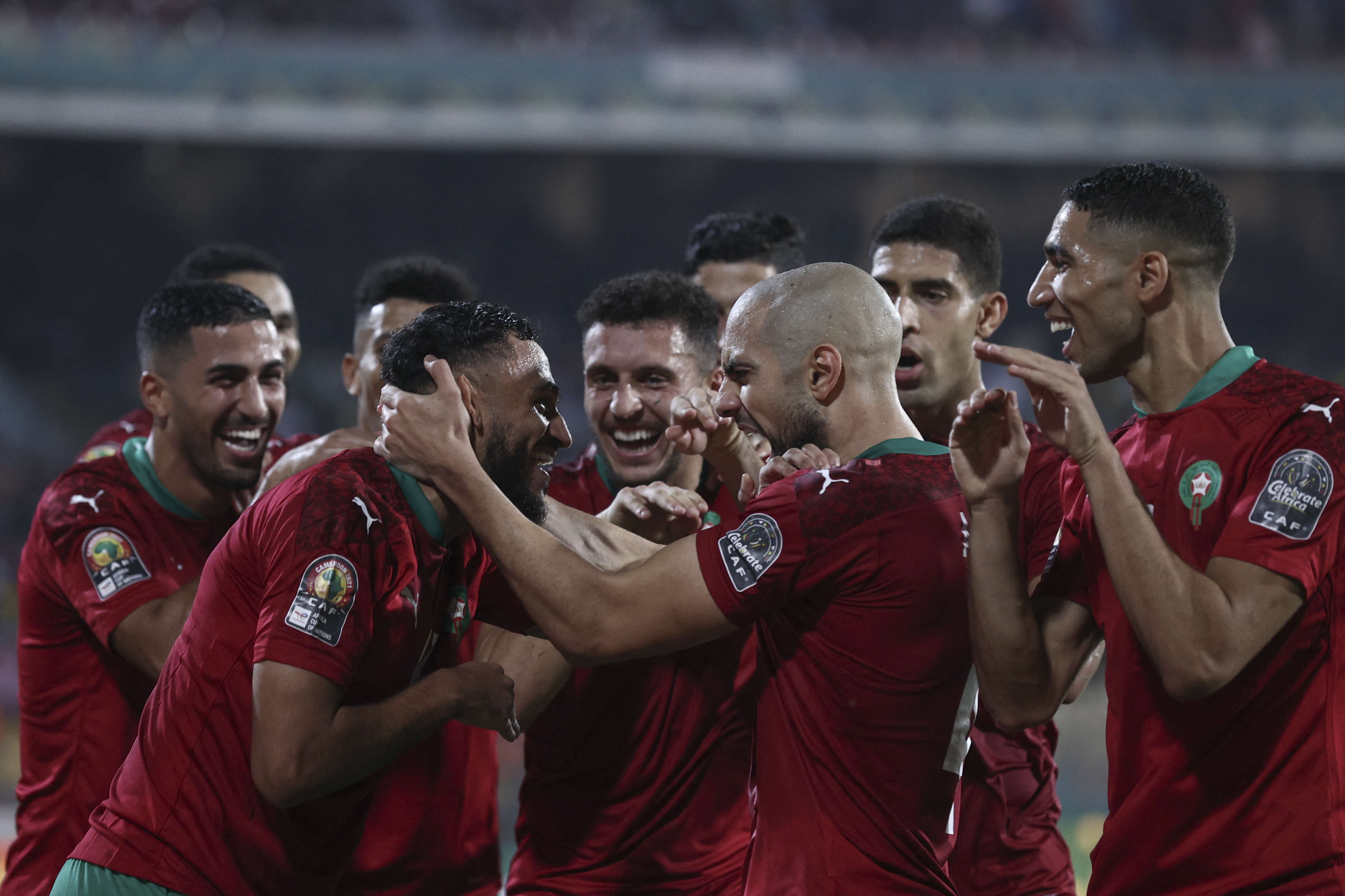 Morocco's forward Sofiane Boufal (2nd L) celebrates scoring his team's first goal during the Group C Africa Cup of Nations (CAN) 2021 football match between Gabon and Morocco at Stade Ahmadou Ahidjo in Yaounde on January 18, 2022. (Photo by KENZO TRIBOUILLARD / AFP)