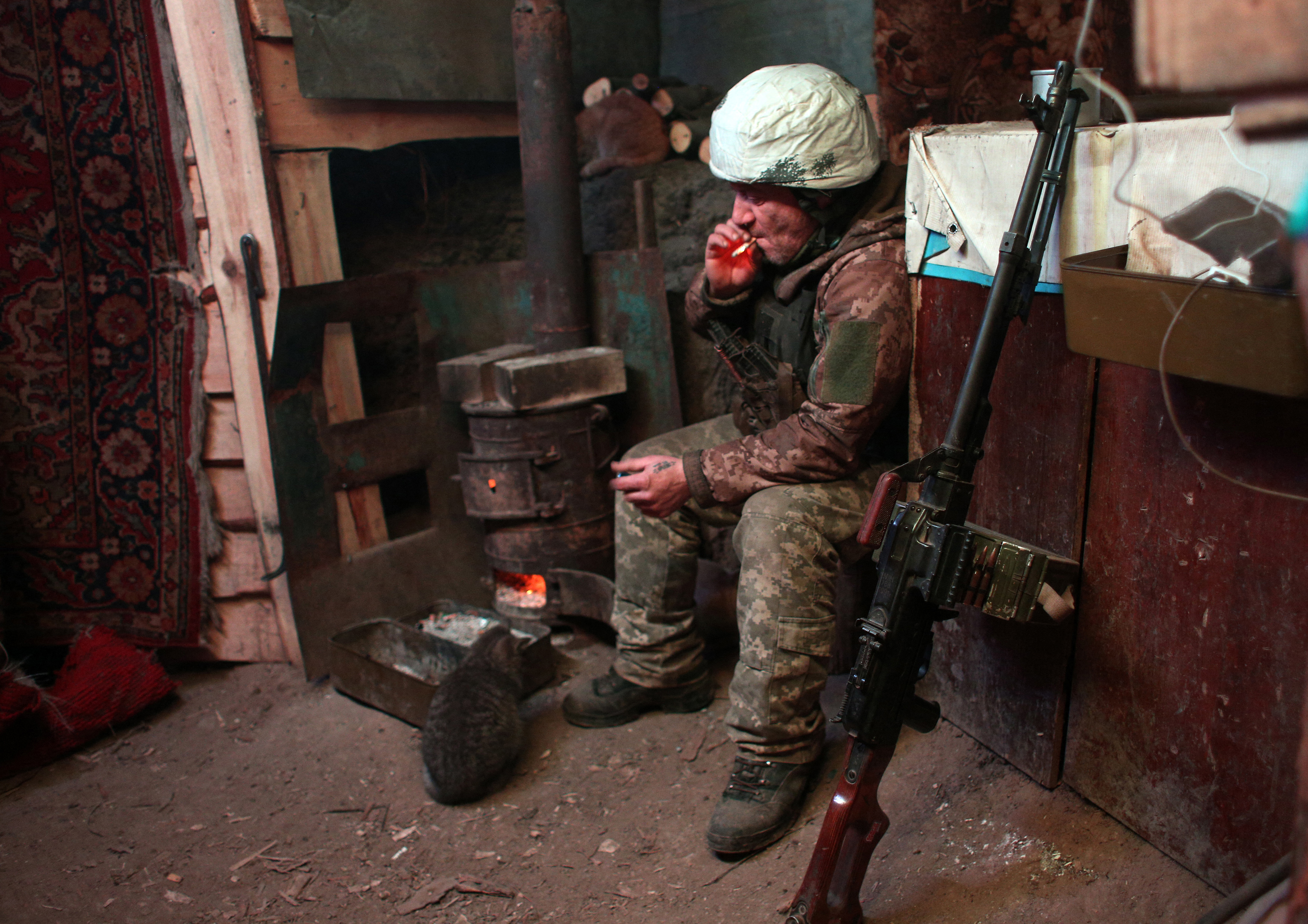 Ukraine soldier sits in bunker
