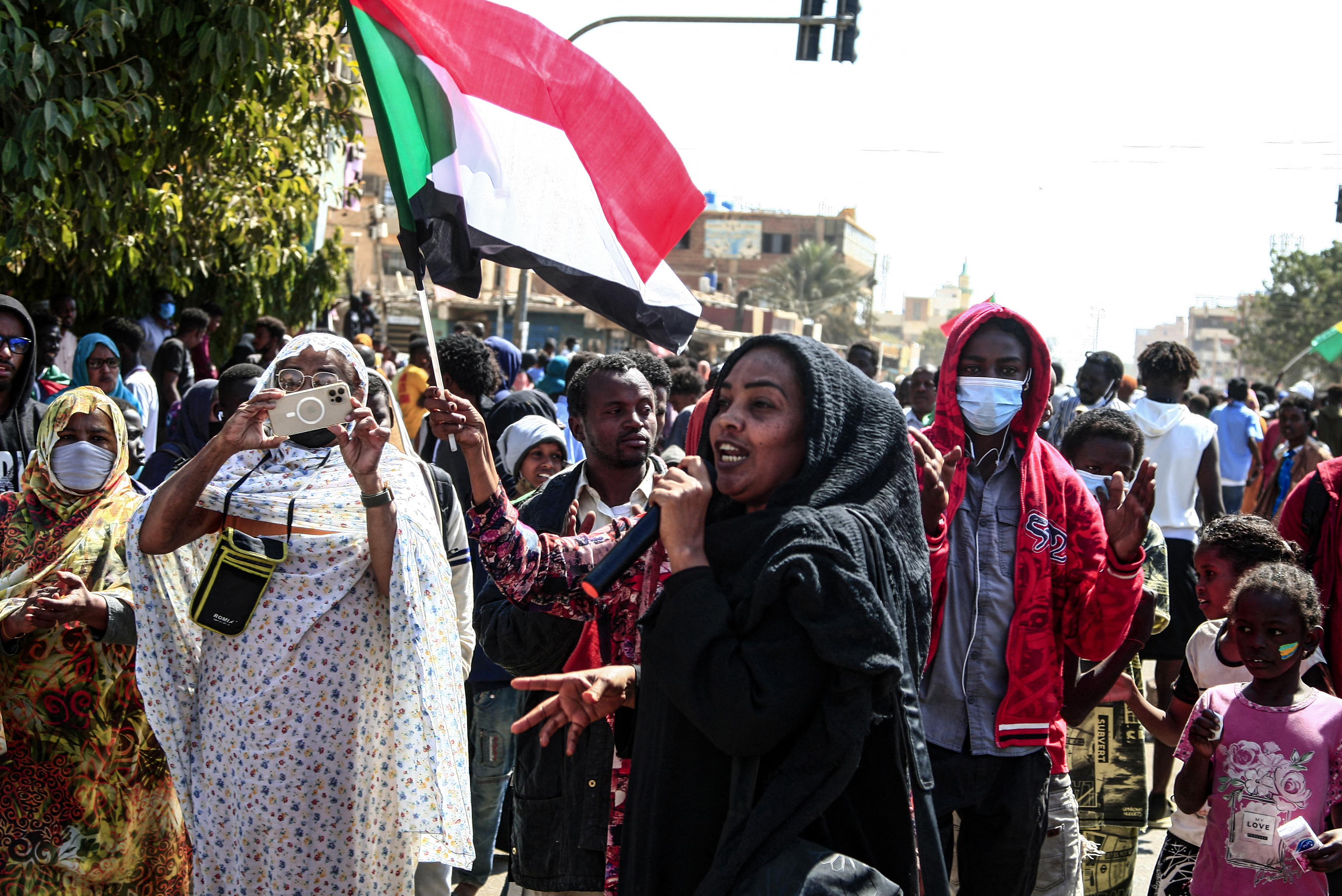 A Sudanese woman speaks during in a rally to protest against last year's military coup, in the capital Khartoum, on January 30, 2022.