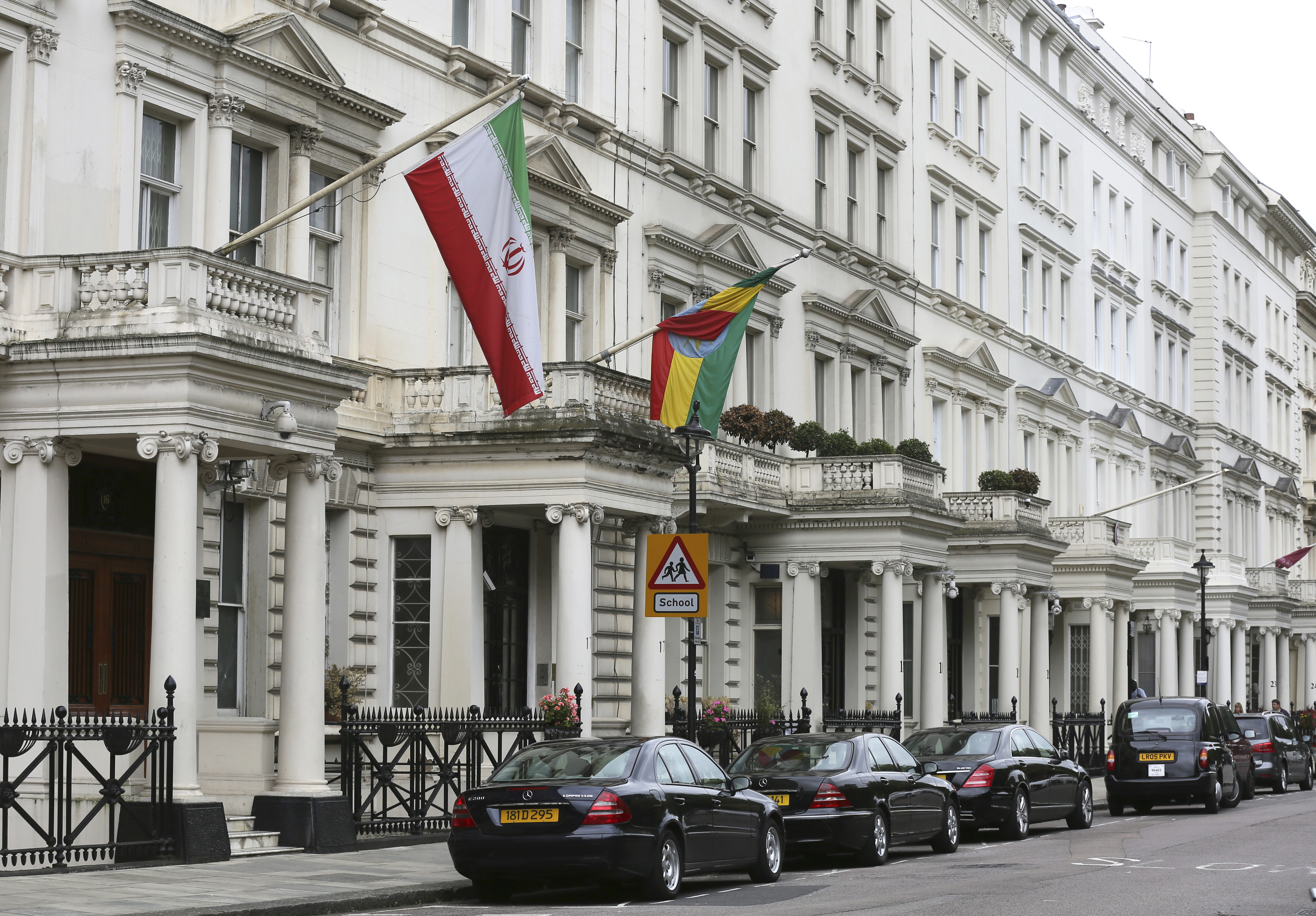 The Iranian flag is seen hanging outside from the building of the Iranian embassy in London, UK