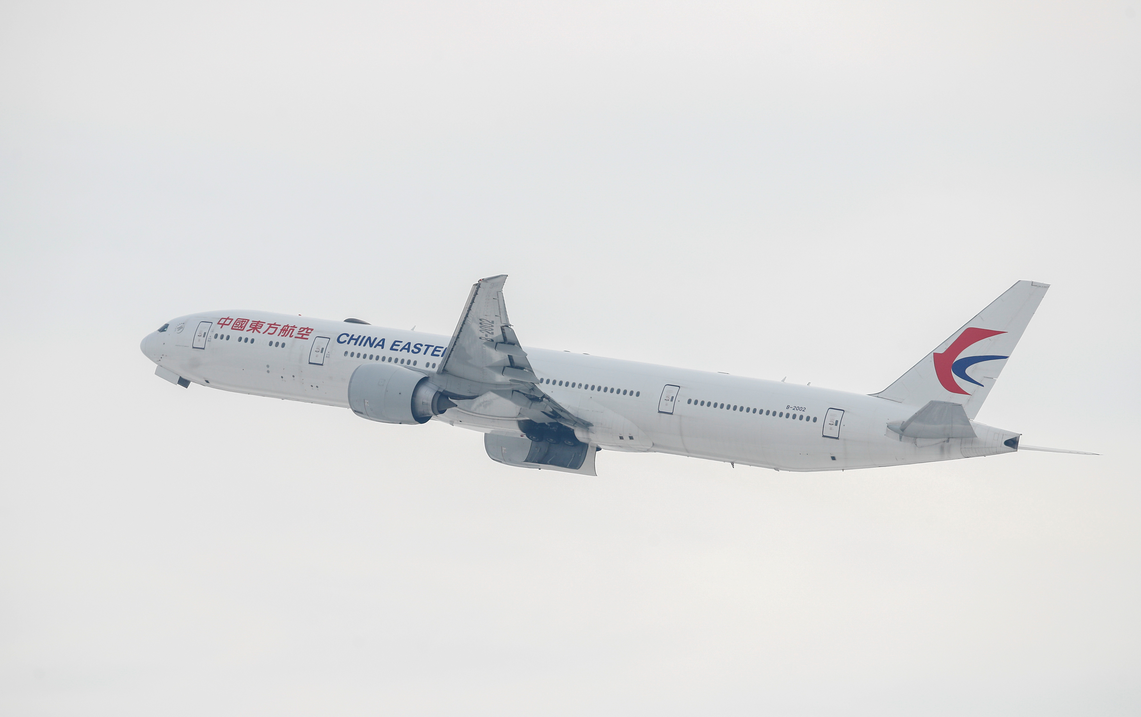 A China Eastern Boeing 777-300 ER in the air shortly after take off from Chicago