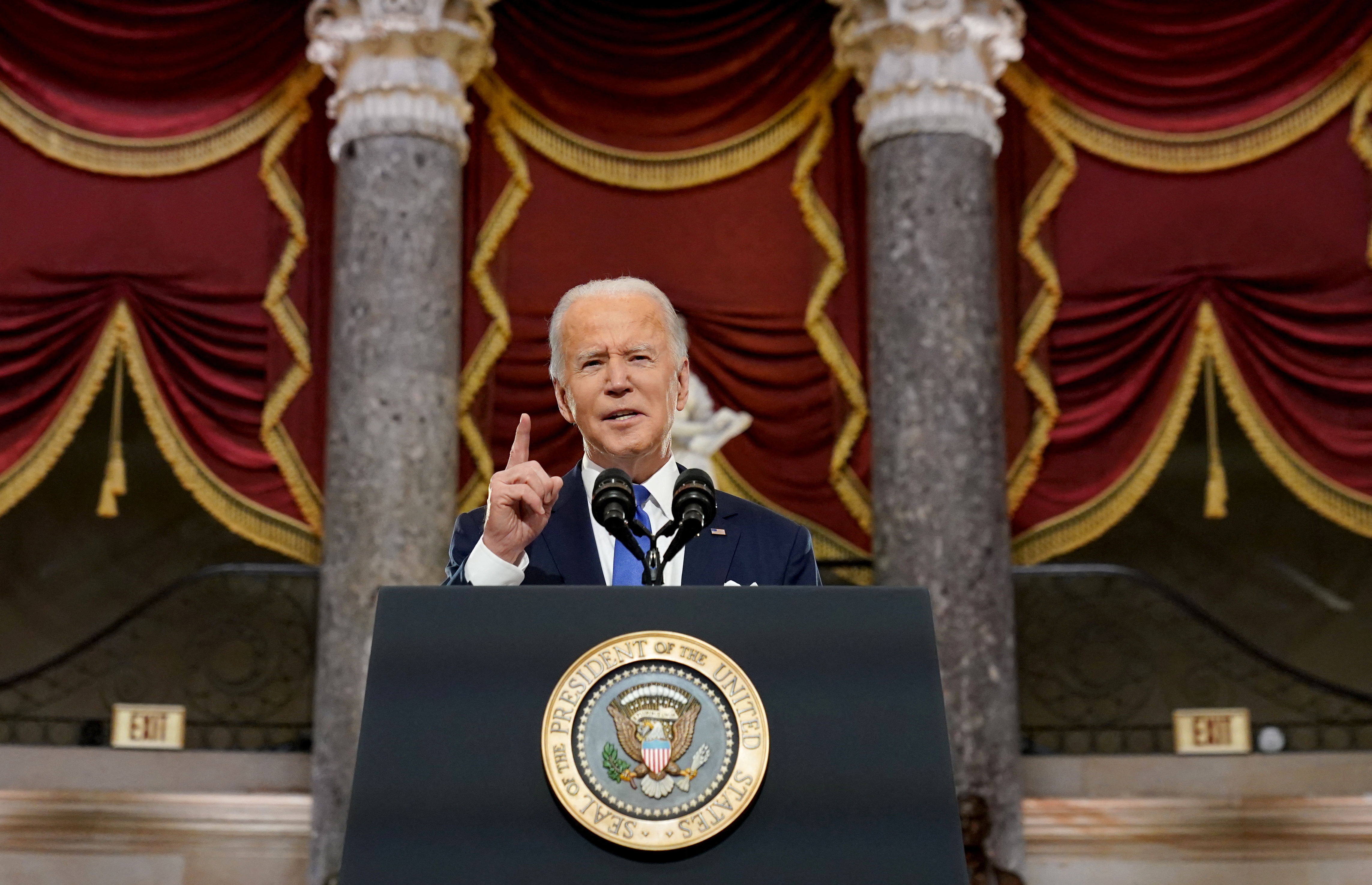 U.S. President Joe Biden speaks in Statuary Hall on the first anniversary of the January 6, 2021 attack on the U.S. Capitol