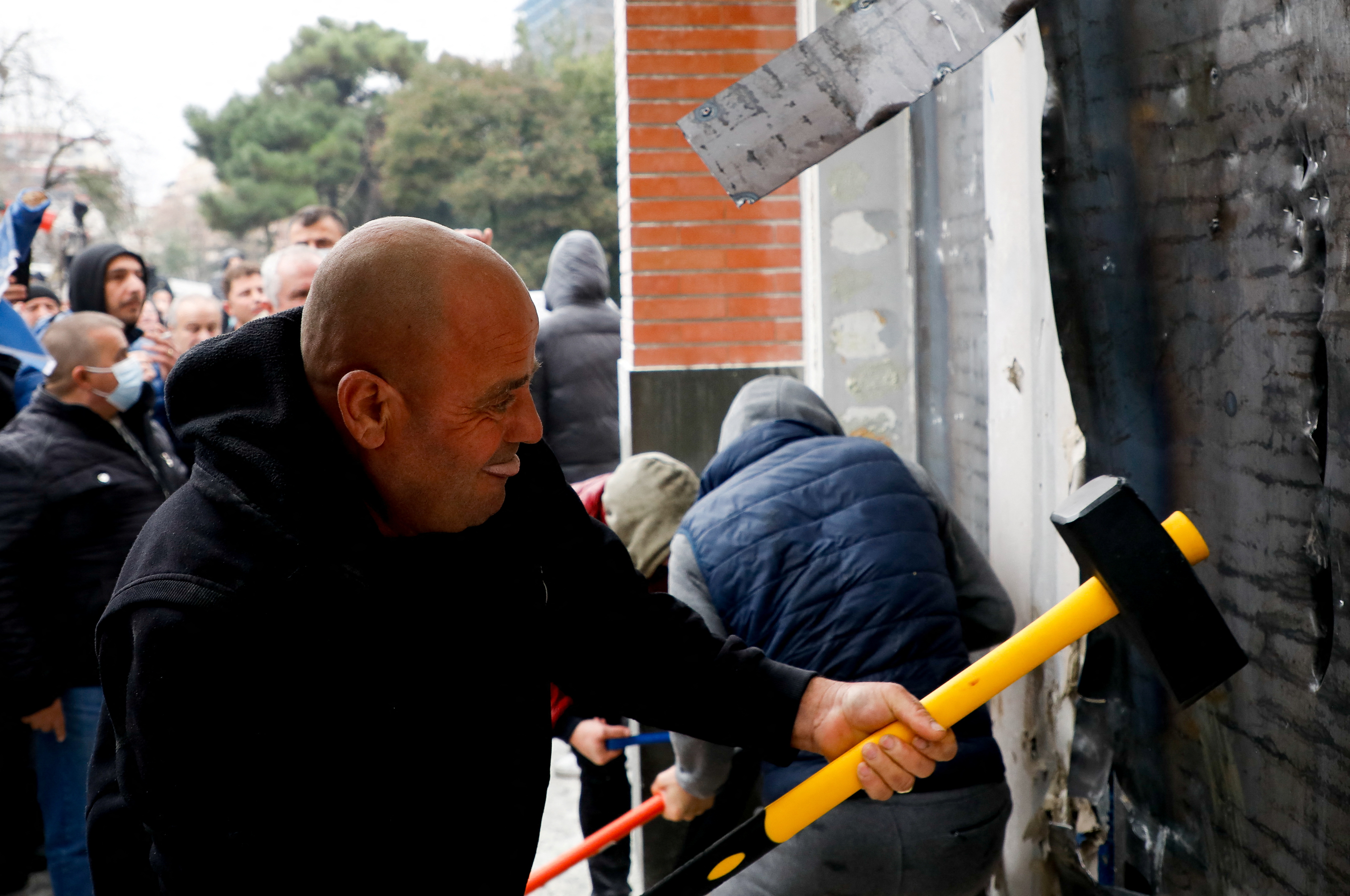 Local media said people inside the building had sought to keep demonstrators out by spraying fire extinguishers before police arrived