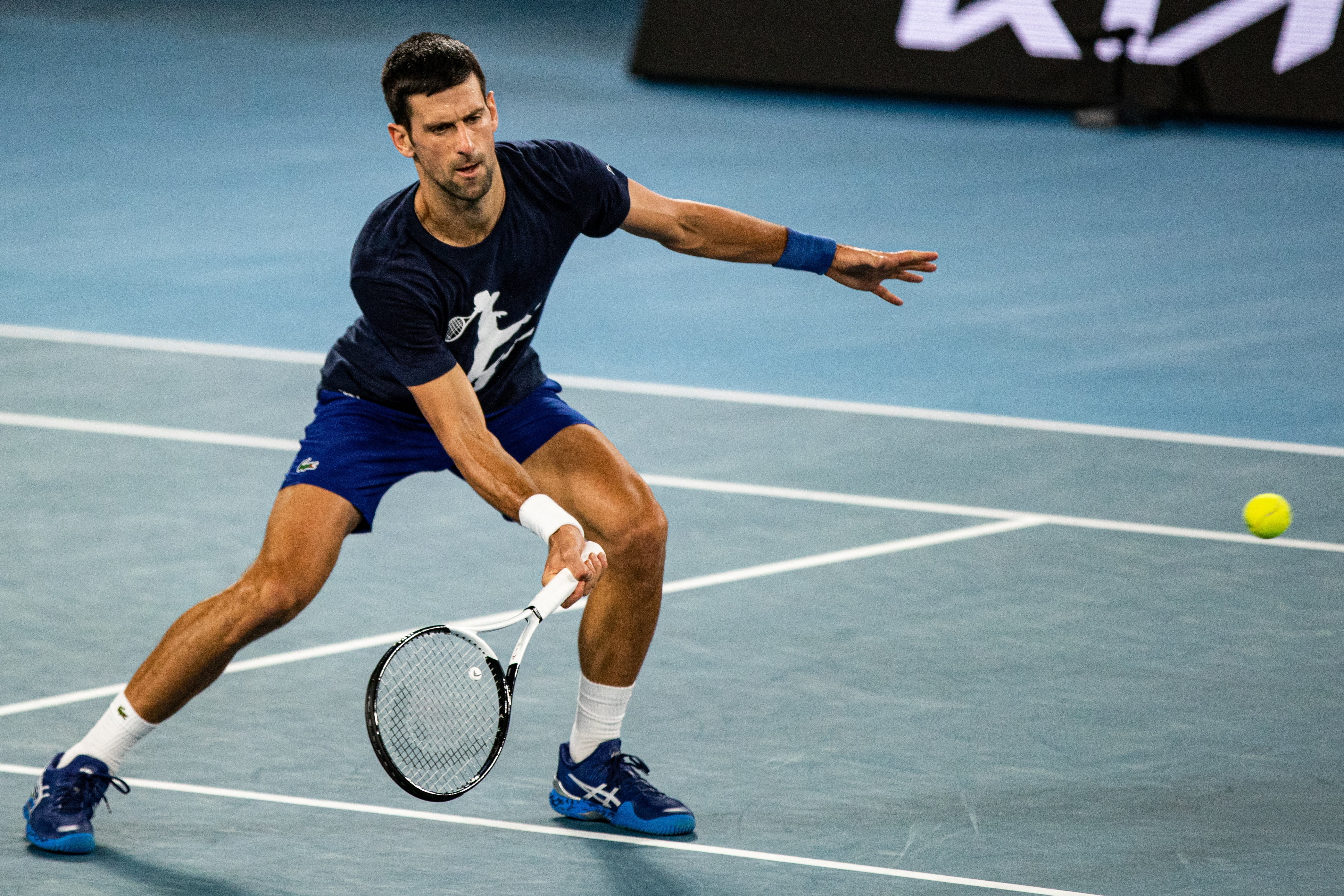 Djokovic playing tennis in Melbourne Park