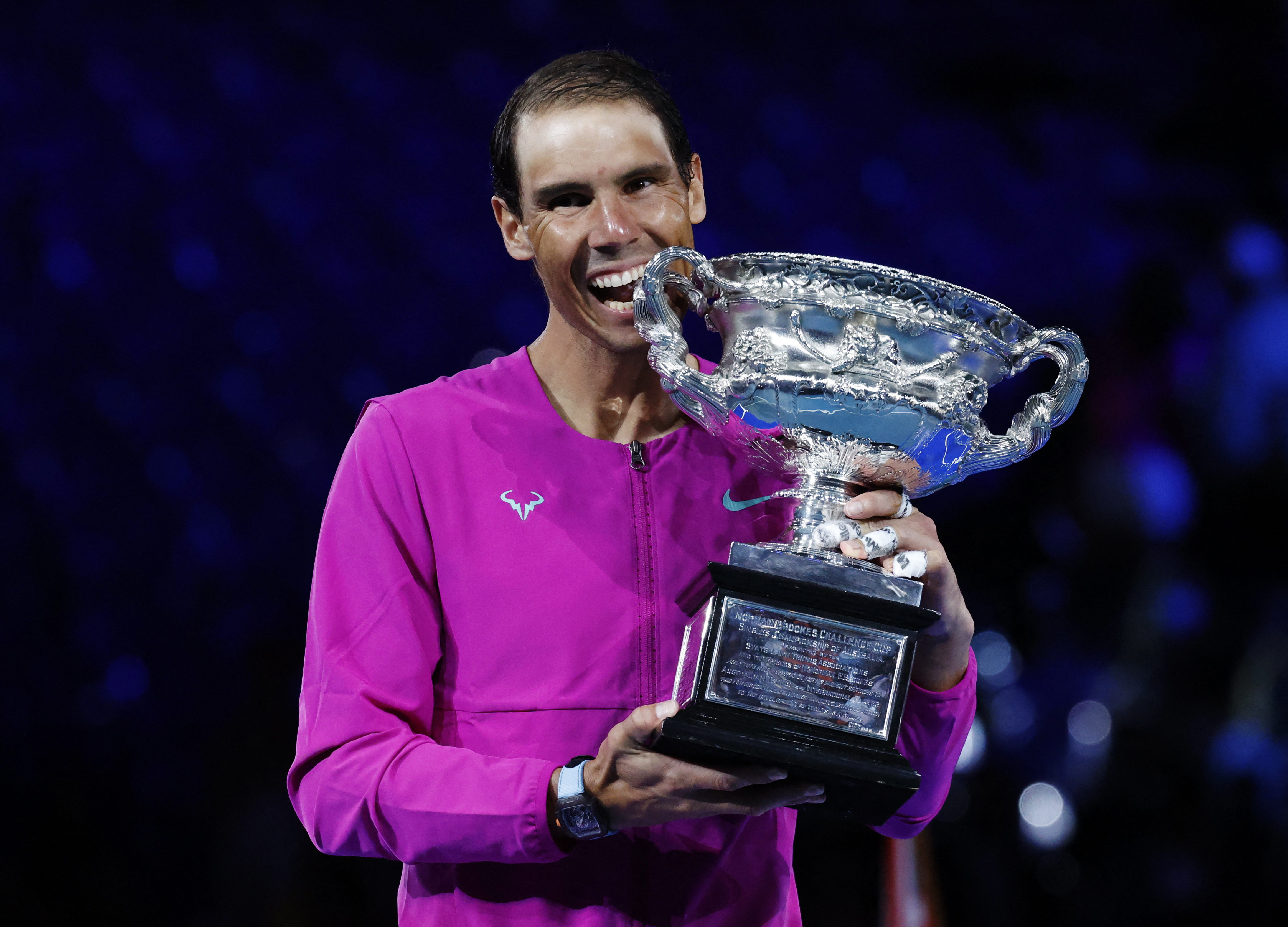 Rafael Nadal celebrates after winning the men's Australian Open singles final with the trophy