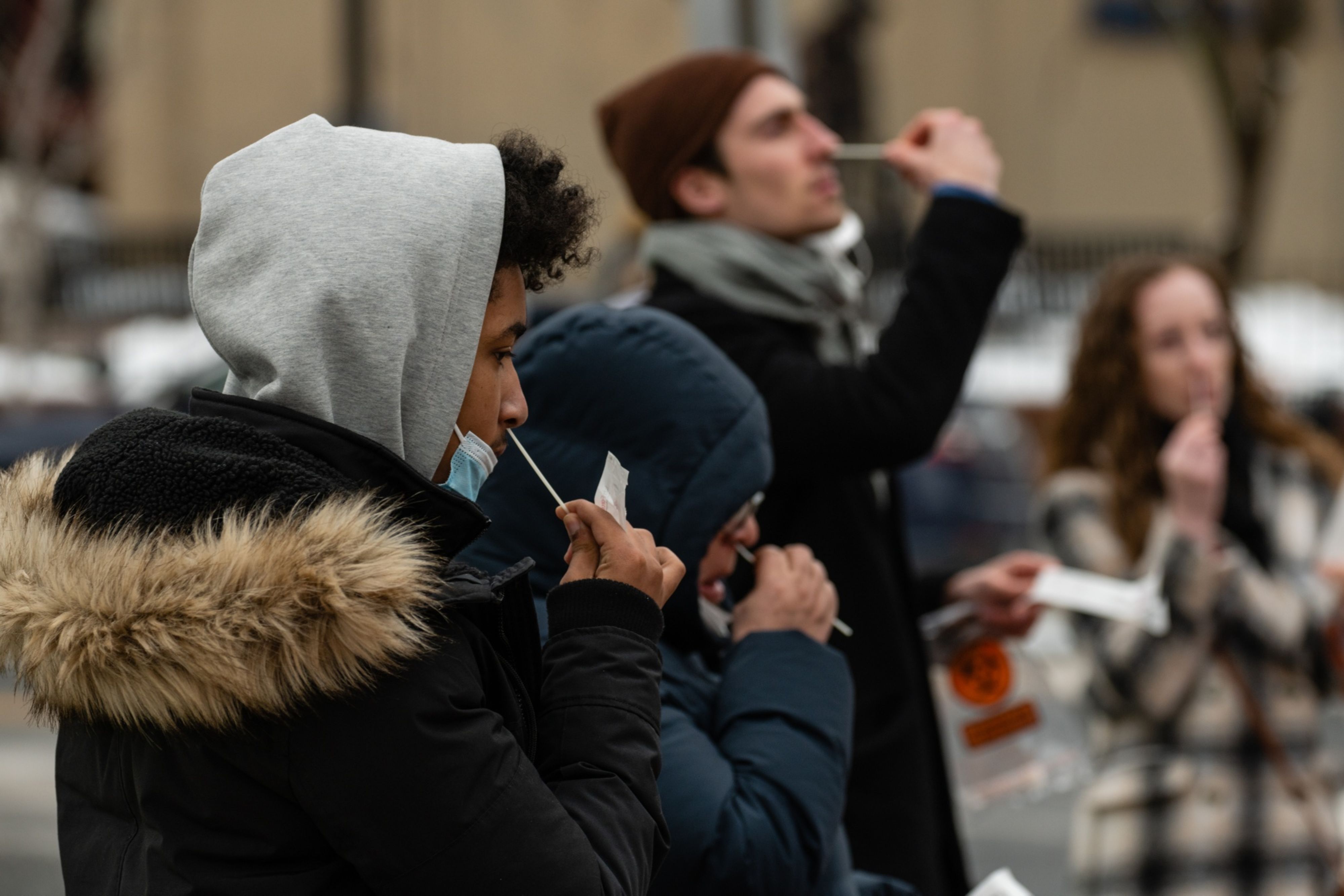 Residents self-administer Covid-19 PCR tests at a testing site run by the Centers for Disease Control (CDC), Federal Emergency Management Agency (FEMA) and eTrueNorth in Washington, D.C., U.S., on Wednesday, Jan. 5, 2022