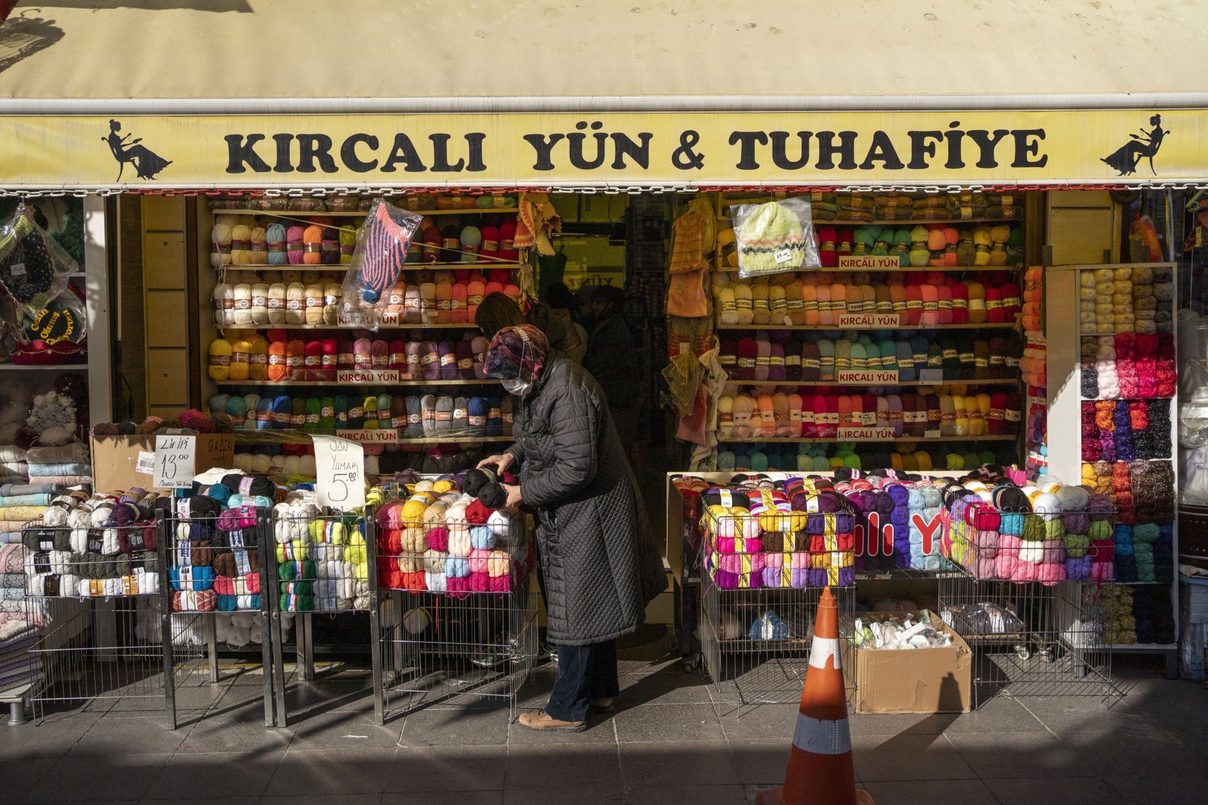 A shopper browses wool at a haberdashery store in Eskisehir, Turkey