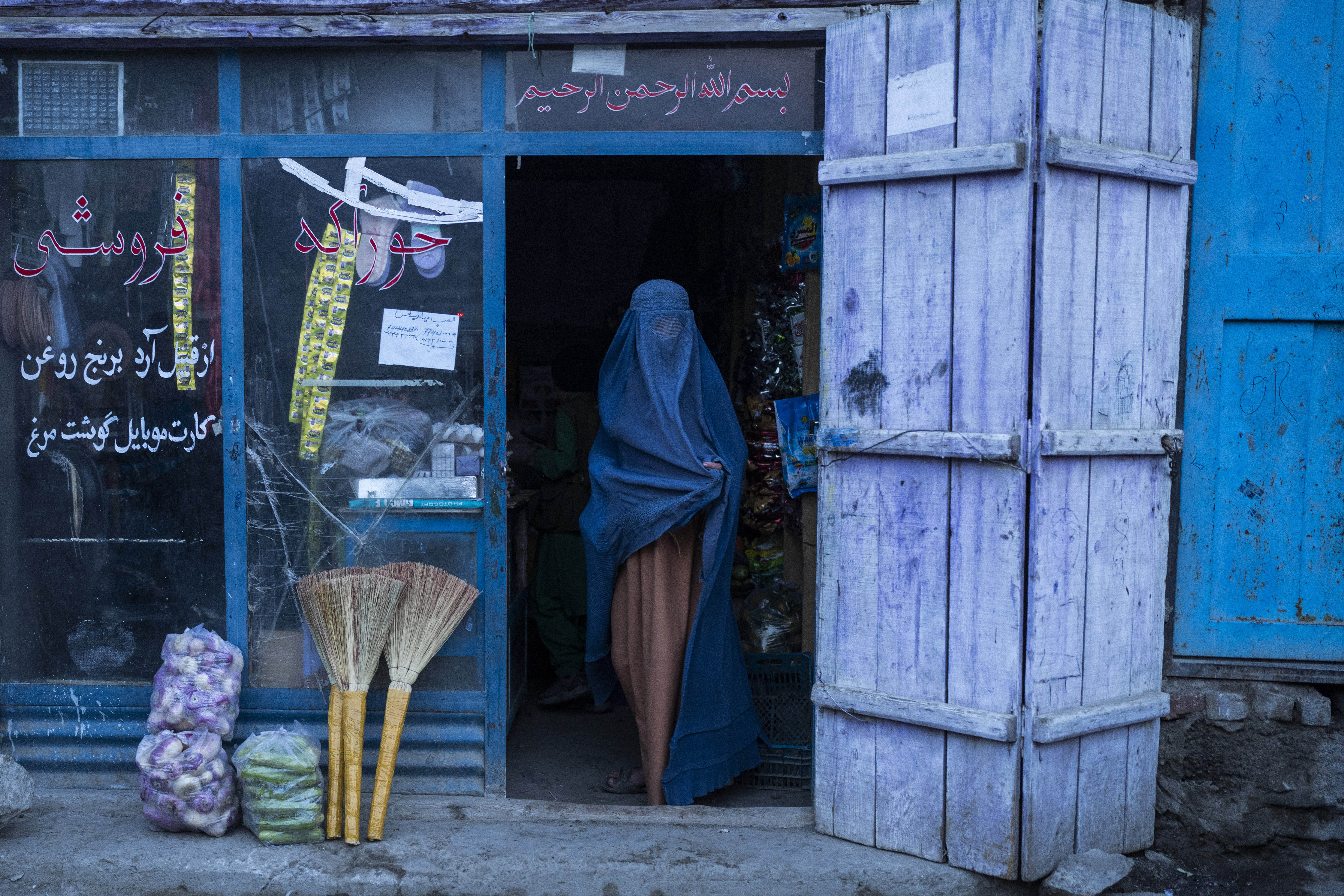 An Afghan woman at a shop in Kabul, Afghanistan