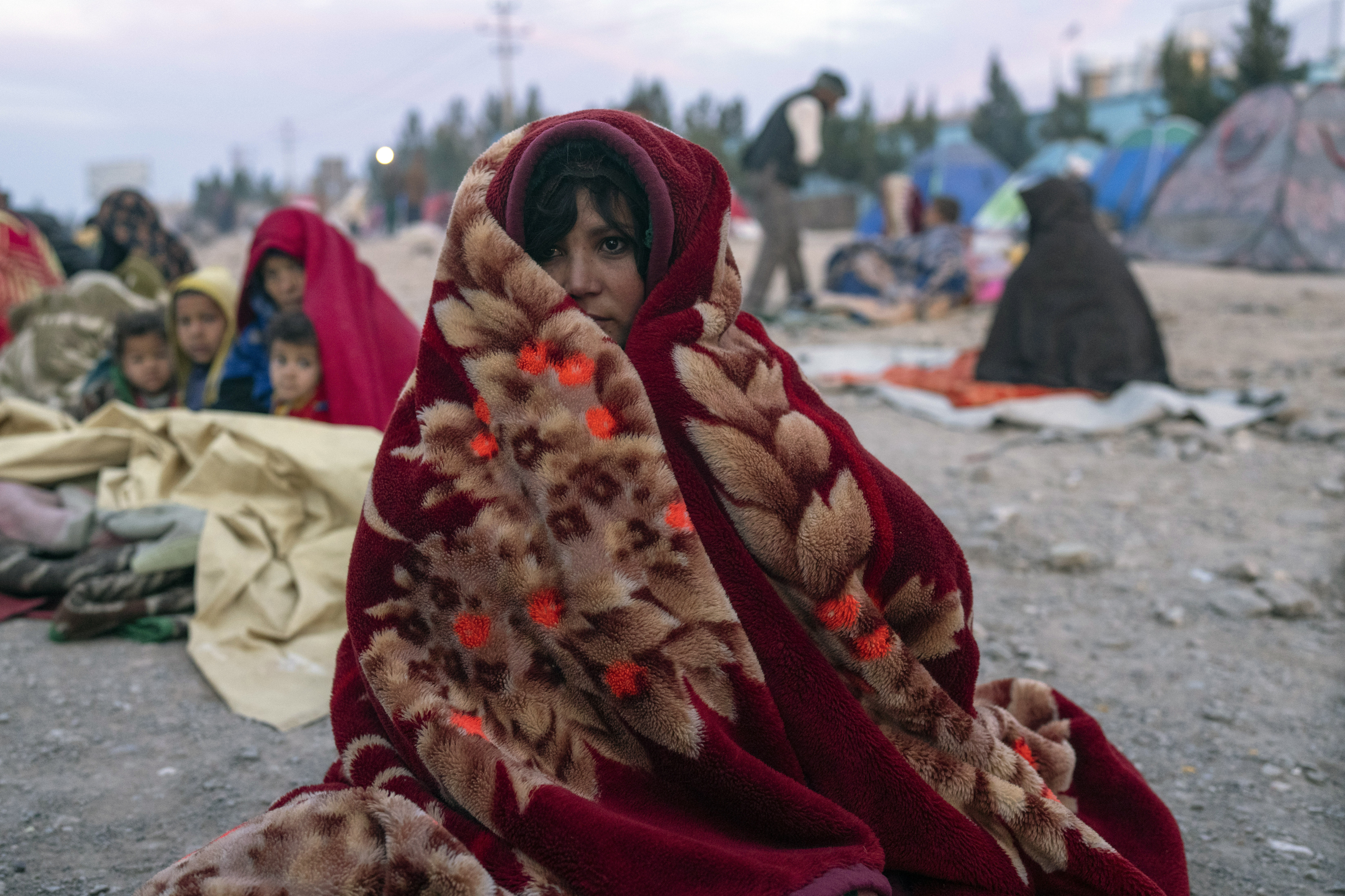 An Afghan woman is wrapped in a blanket in Herat, Afghanistan.