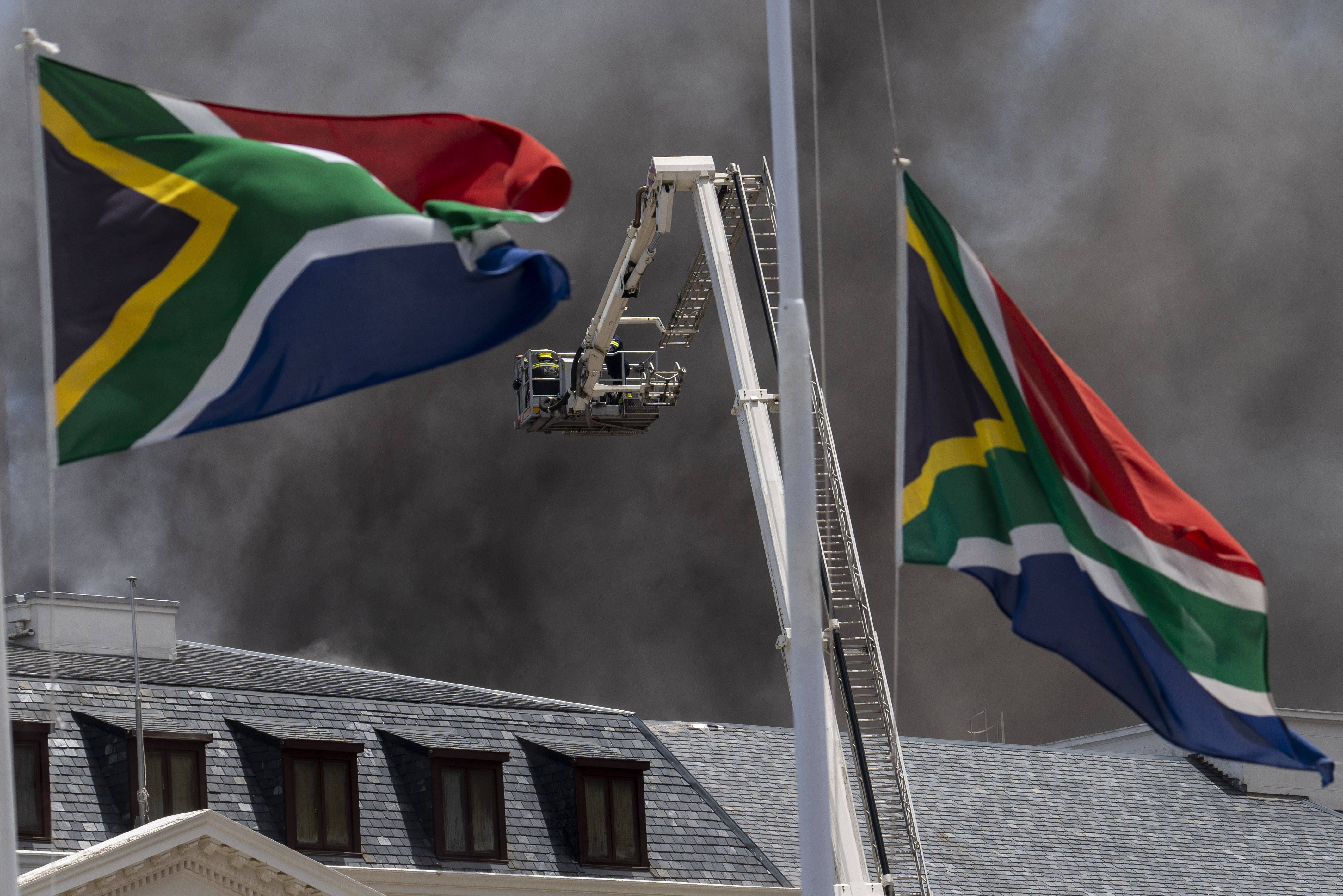 Firefighters try to extinguish flames at the South African Parliament