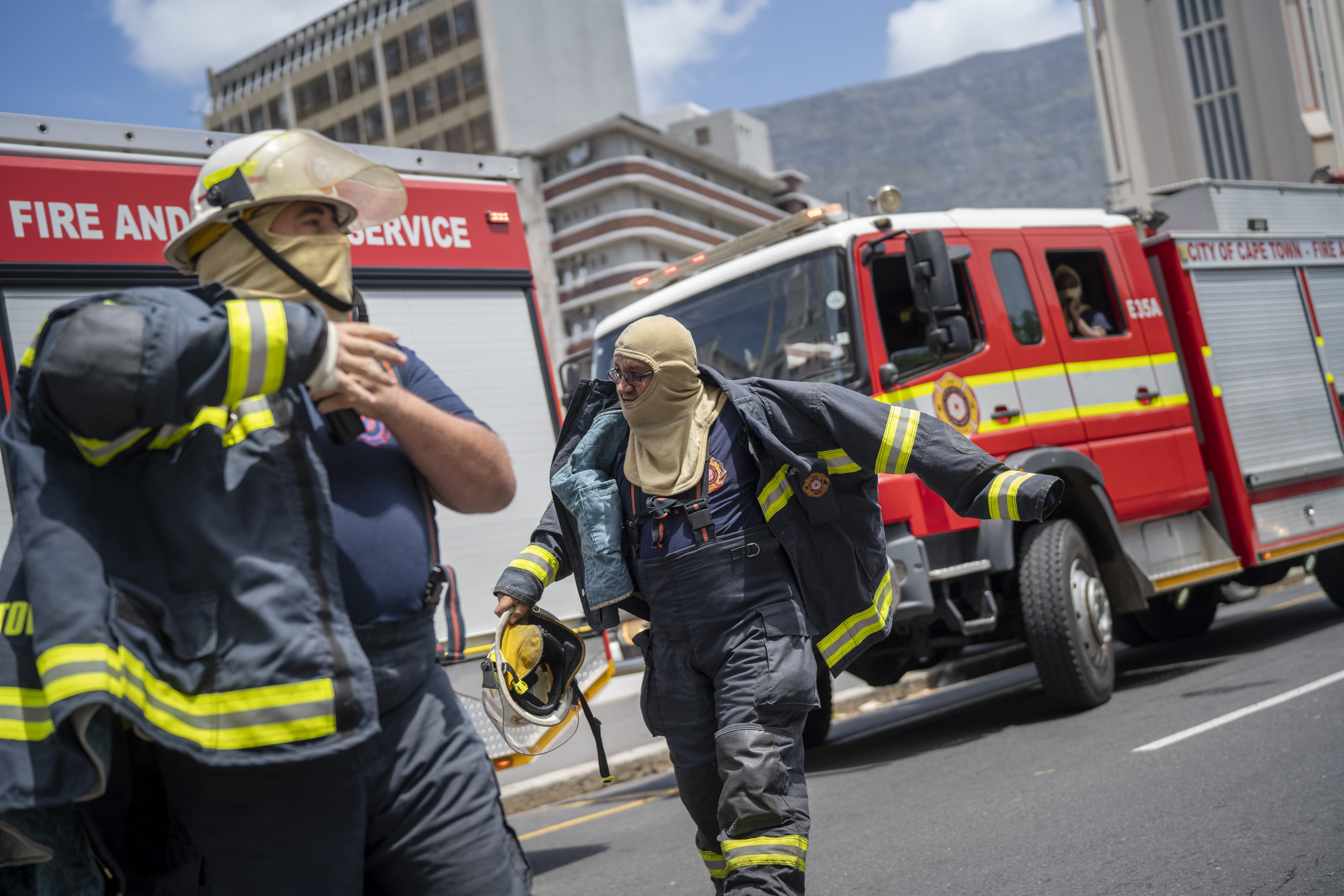 Firefighters try to extinguish flames at the South African Parliament