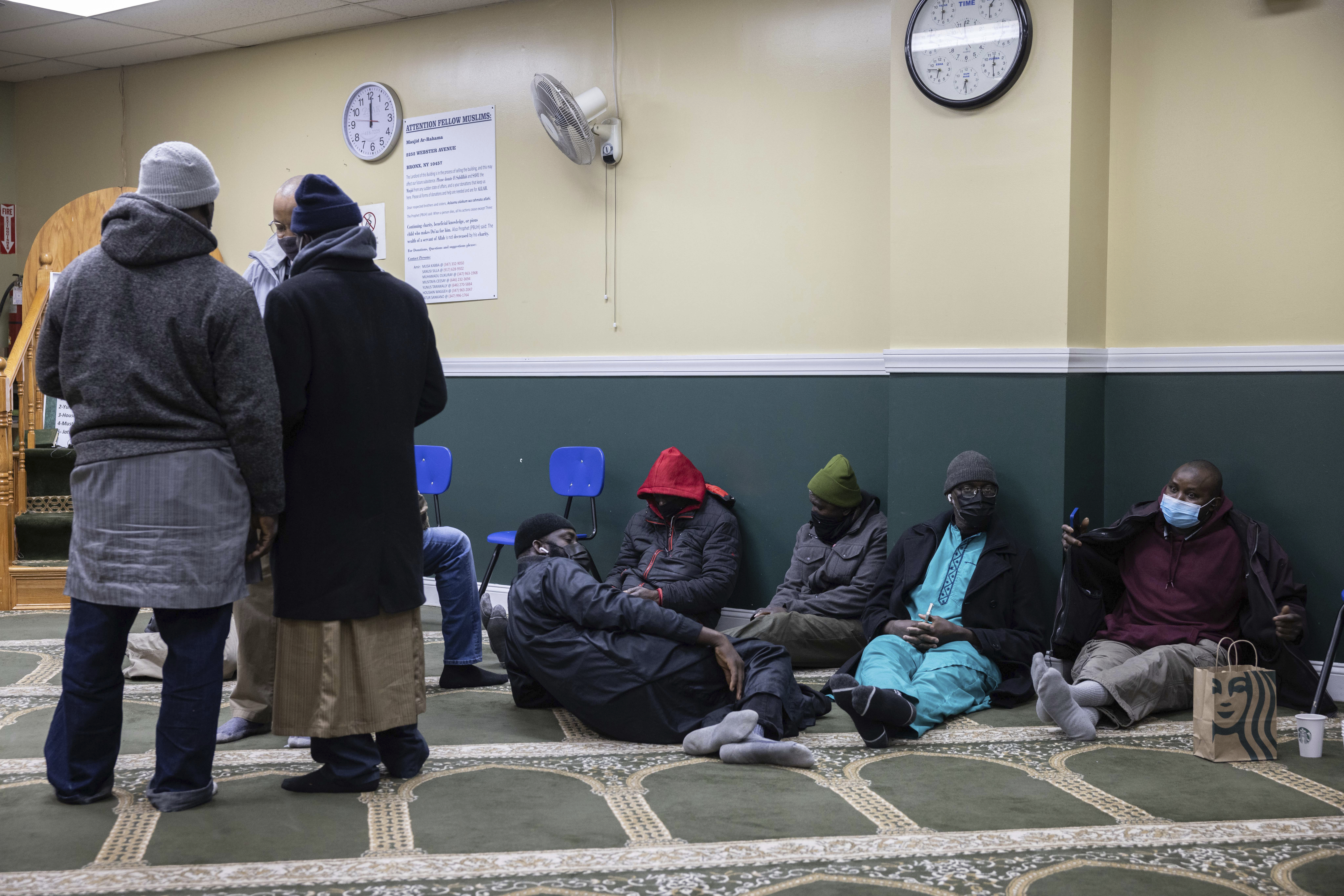 Family members sitting on floor while waiting for information about missing loved ones