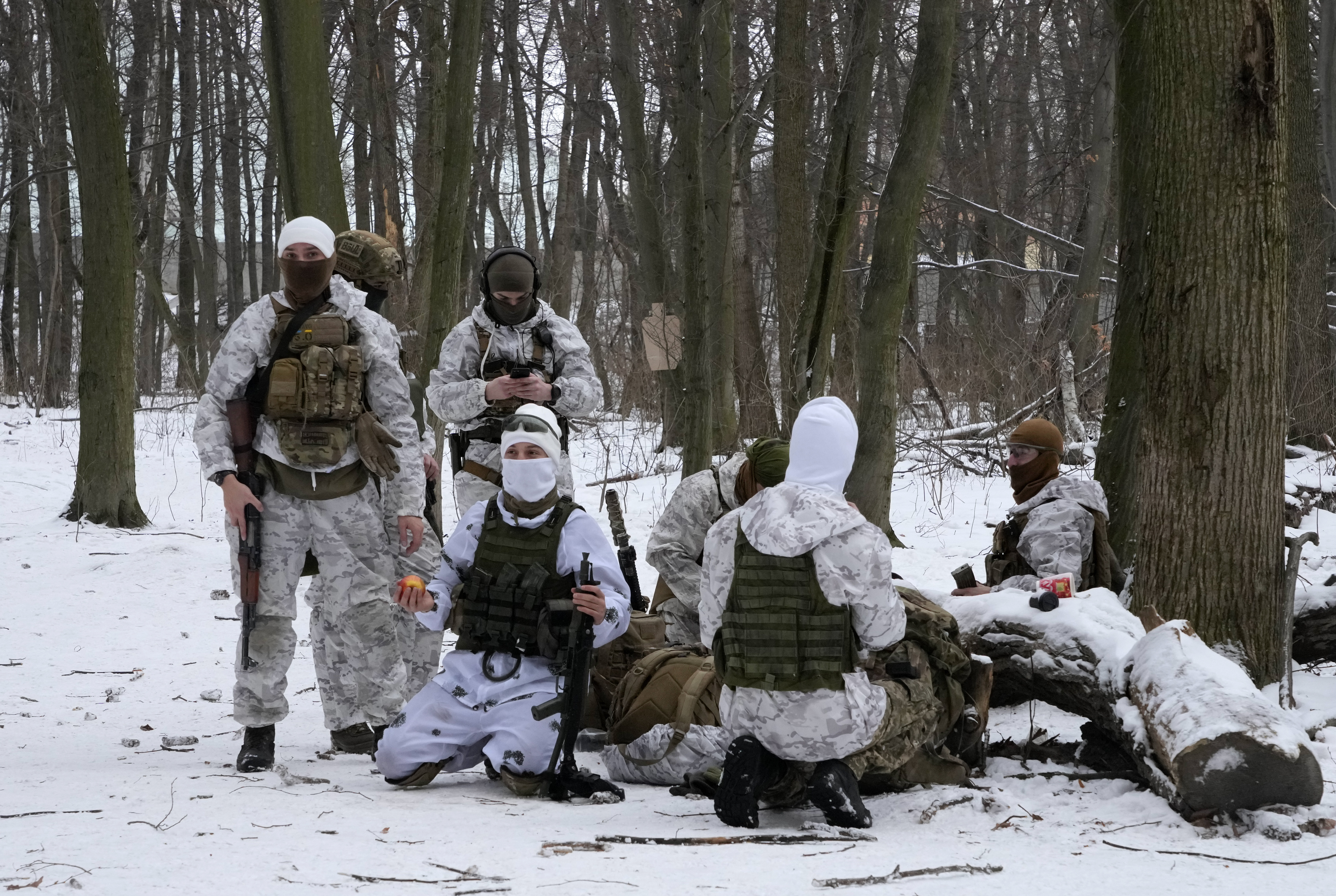 Members of Ukraine's Territorial Defense Forces, volunteer military units of the Armed Forces, train in a city park in Kyiv