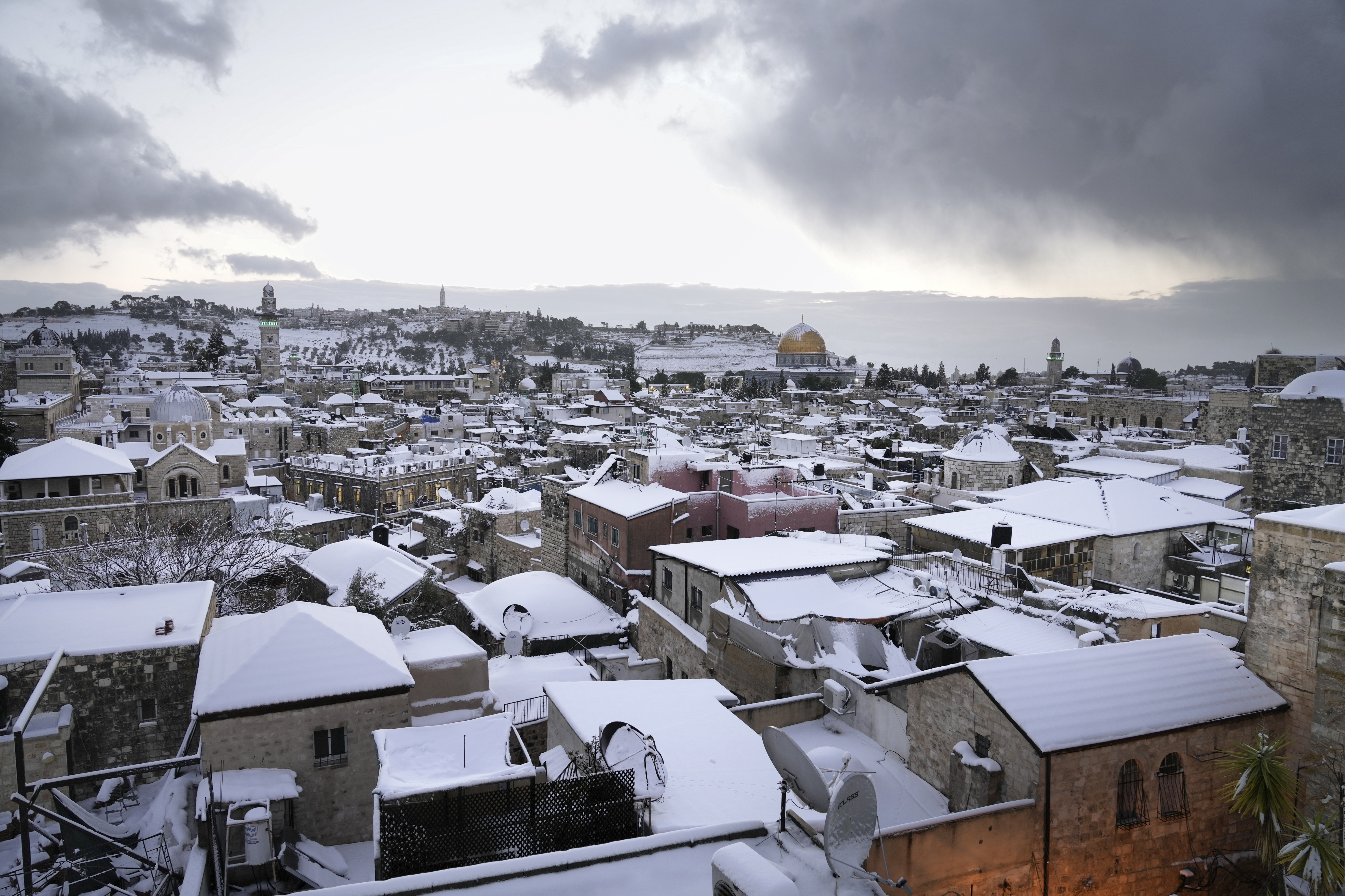 Snow covers the Dome of the Rock Mosque