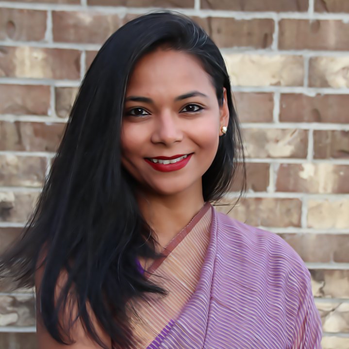Aditi Shrivatsava, founder and CEO, Pocket Aces, posing against a brick wall