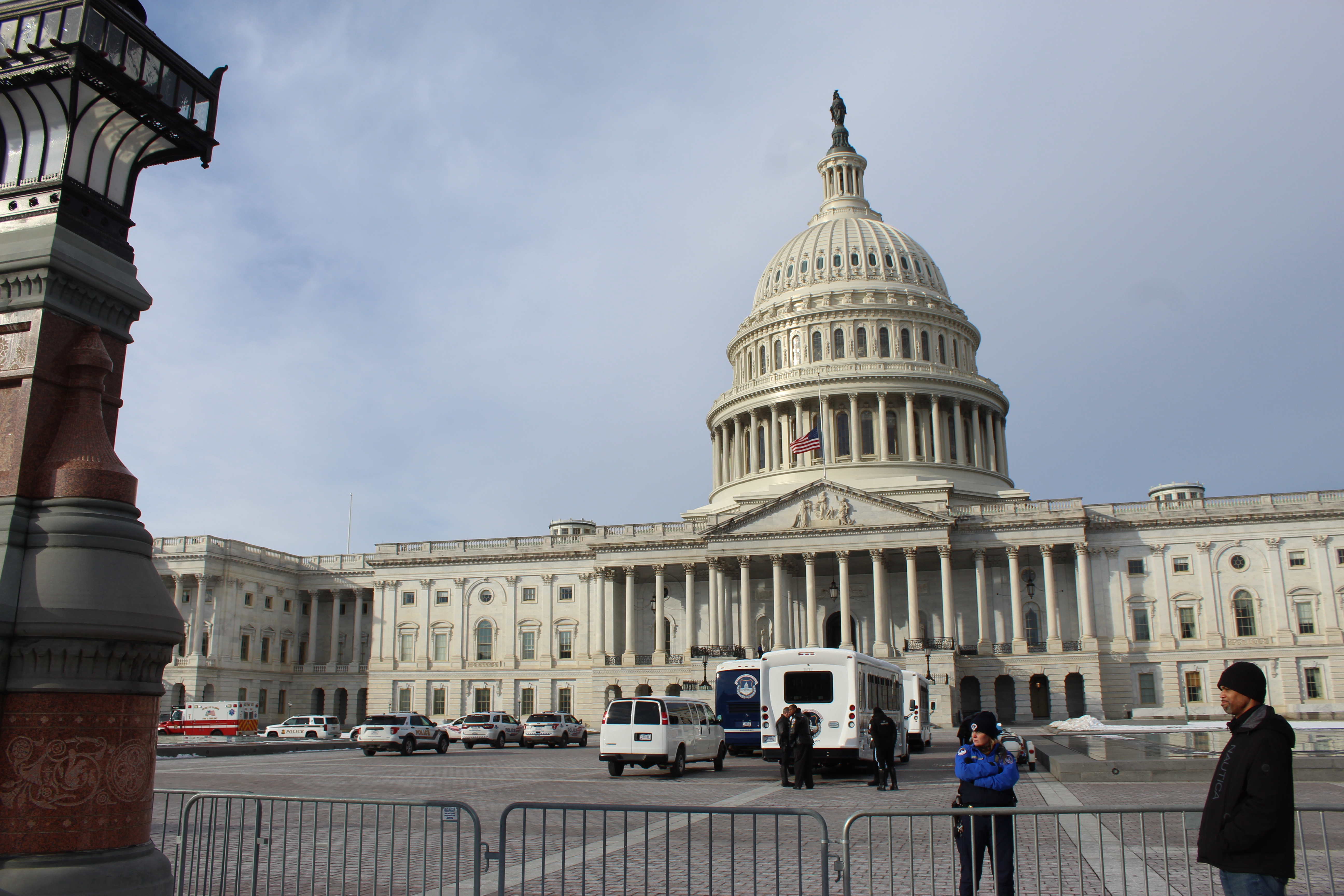 Police officer stands in front of US Capitol