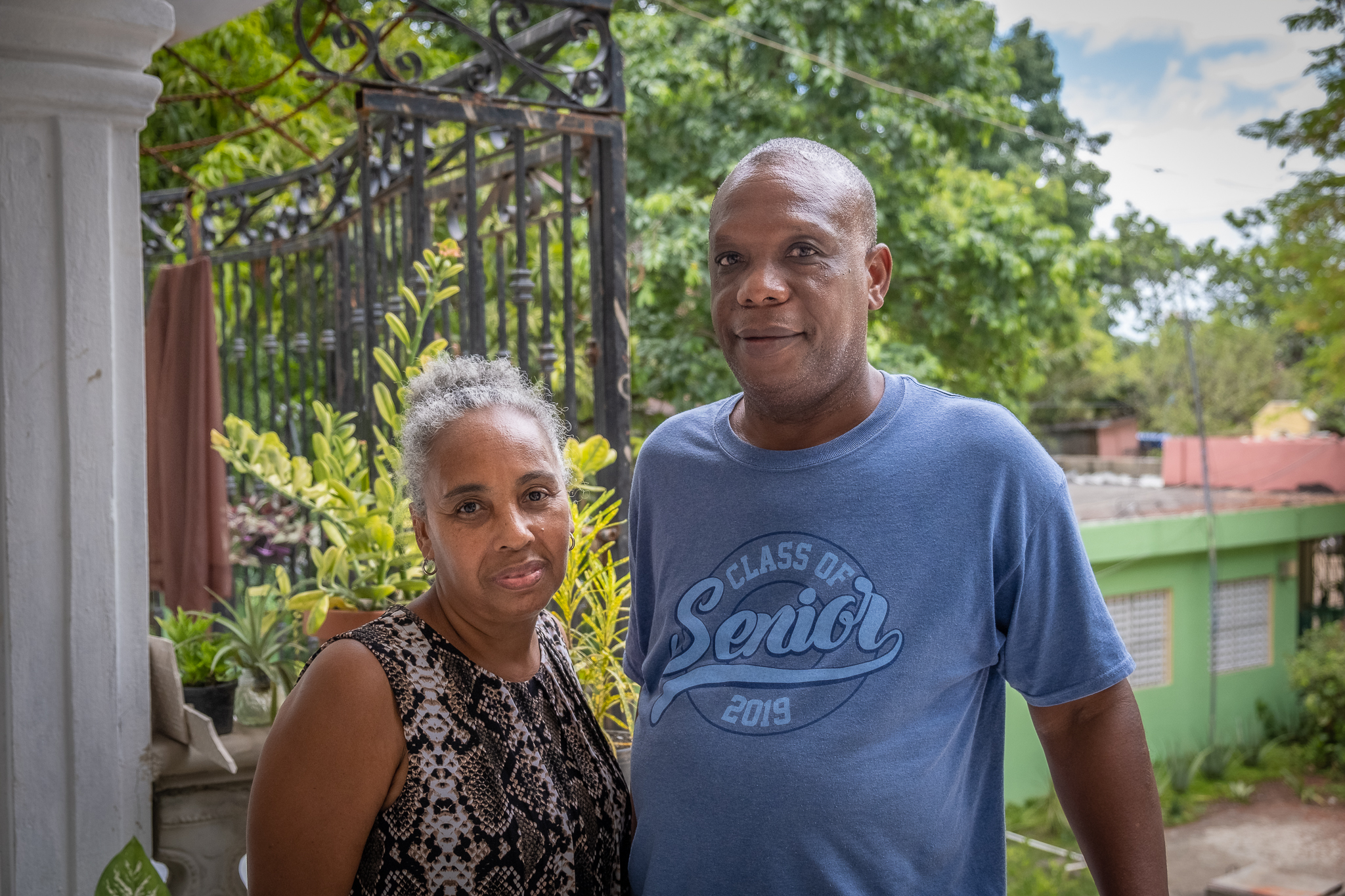 Valerio German, with his wife at their home