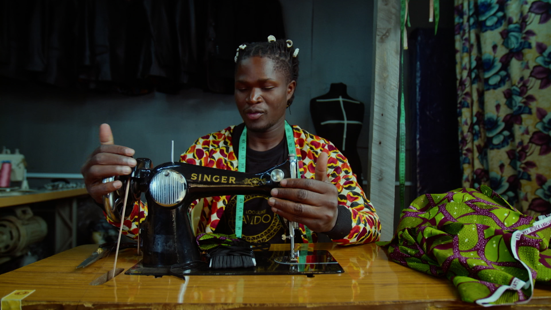 A woman using a sewing machine.