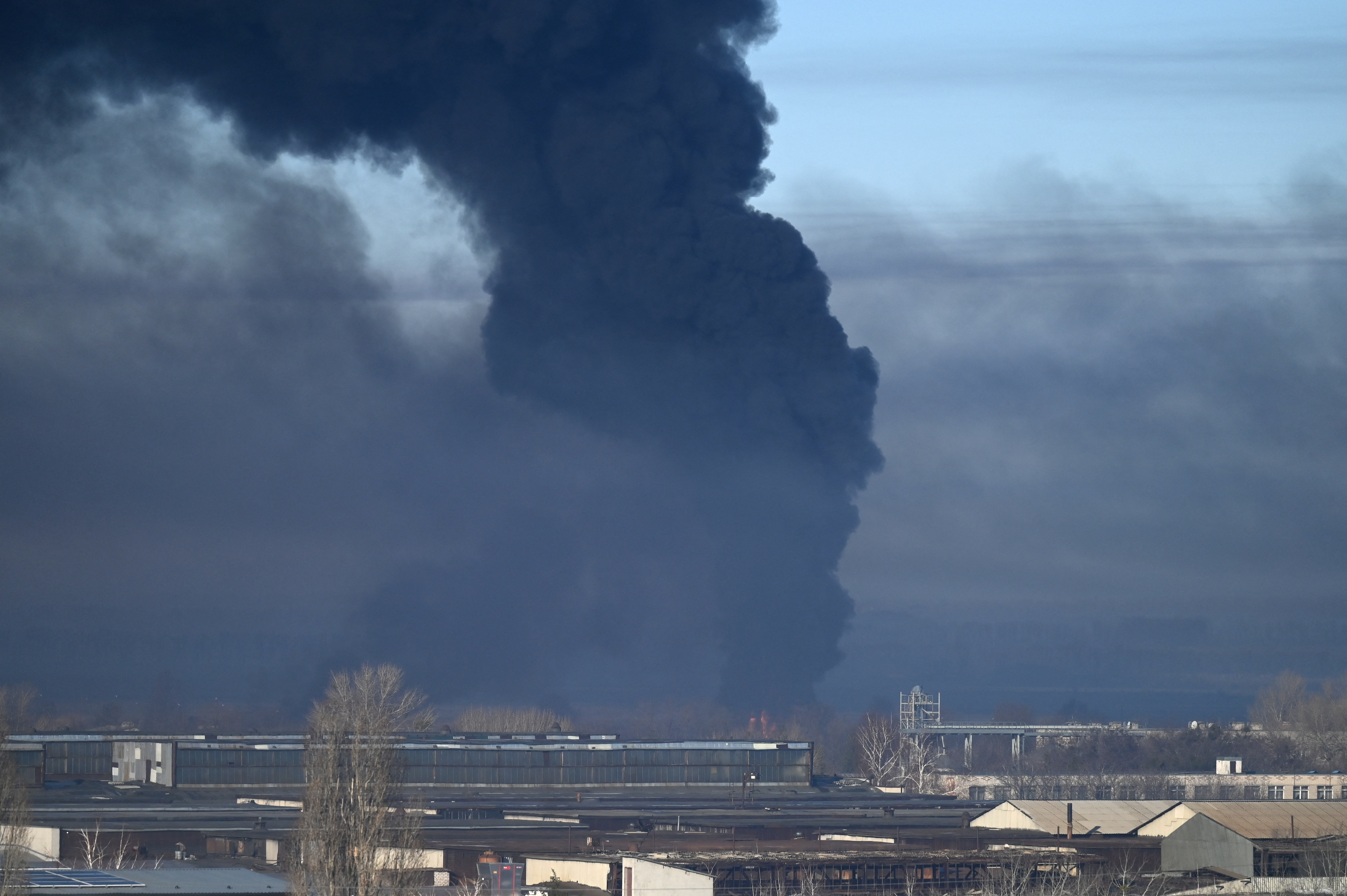 Black smoke rises from a military airport in Chuguyev near Kharkiv