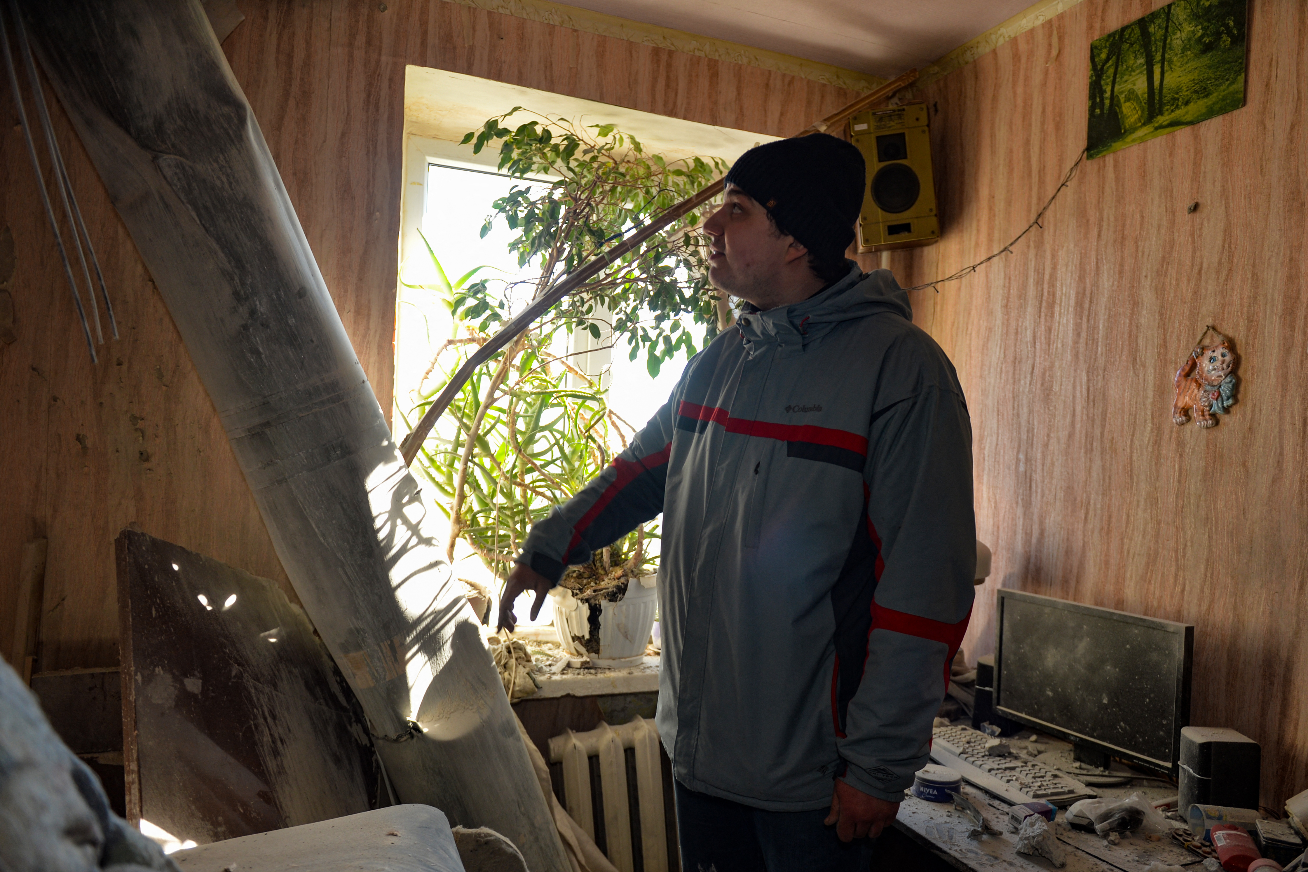 The body of a rocket stuck in a flat after recent shelling on the northern outskirts of Kharkiv