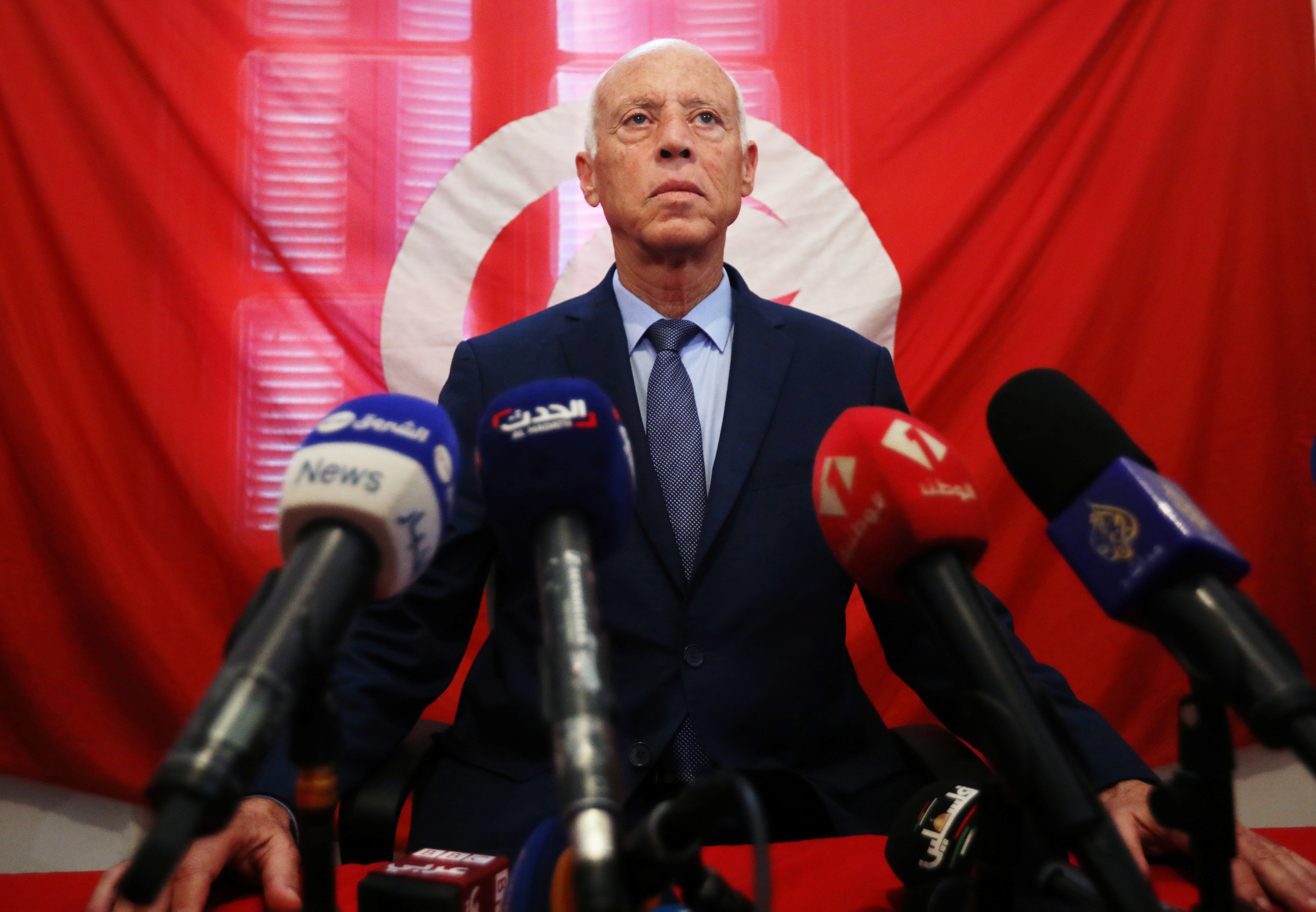 Presidential candidate Kais Saied speaks as he attends a news conference after the announcement of the results in the first round of Tunisia's presidential election in Tunis.