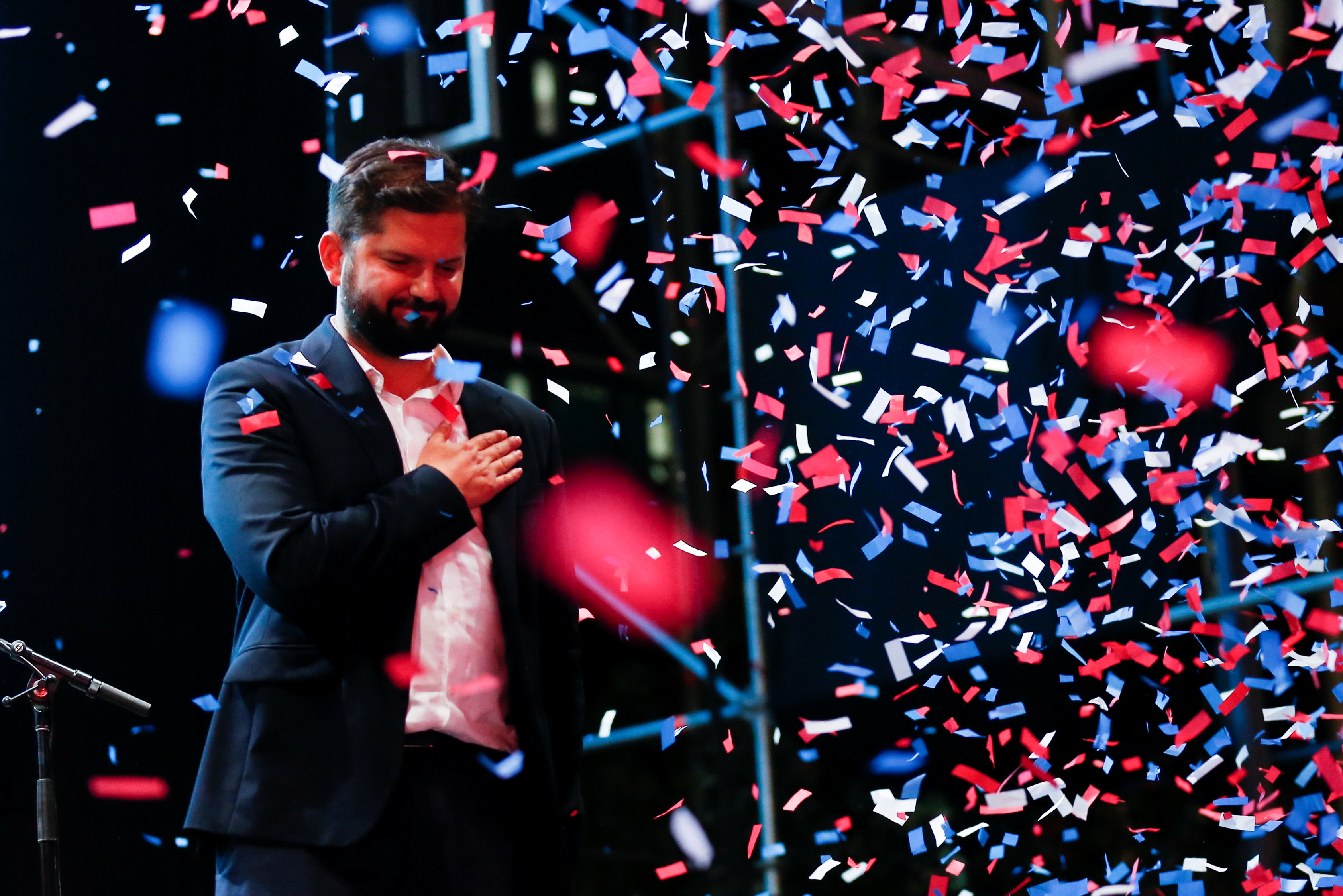 Chile's President-elect Gabriel Boric celebrates with supporters after winning the presidential election