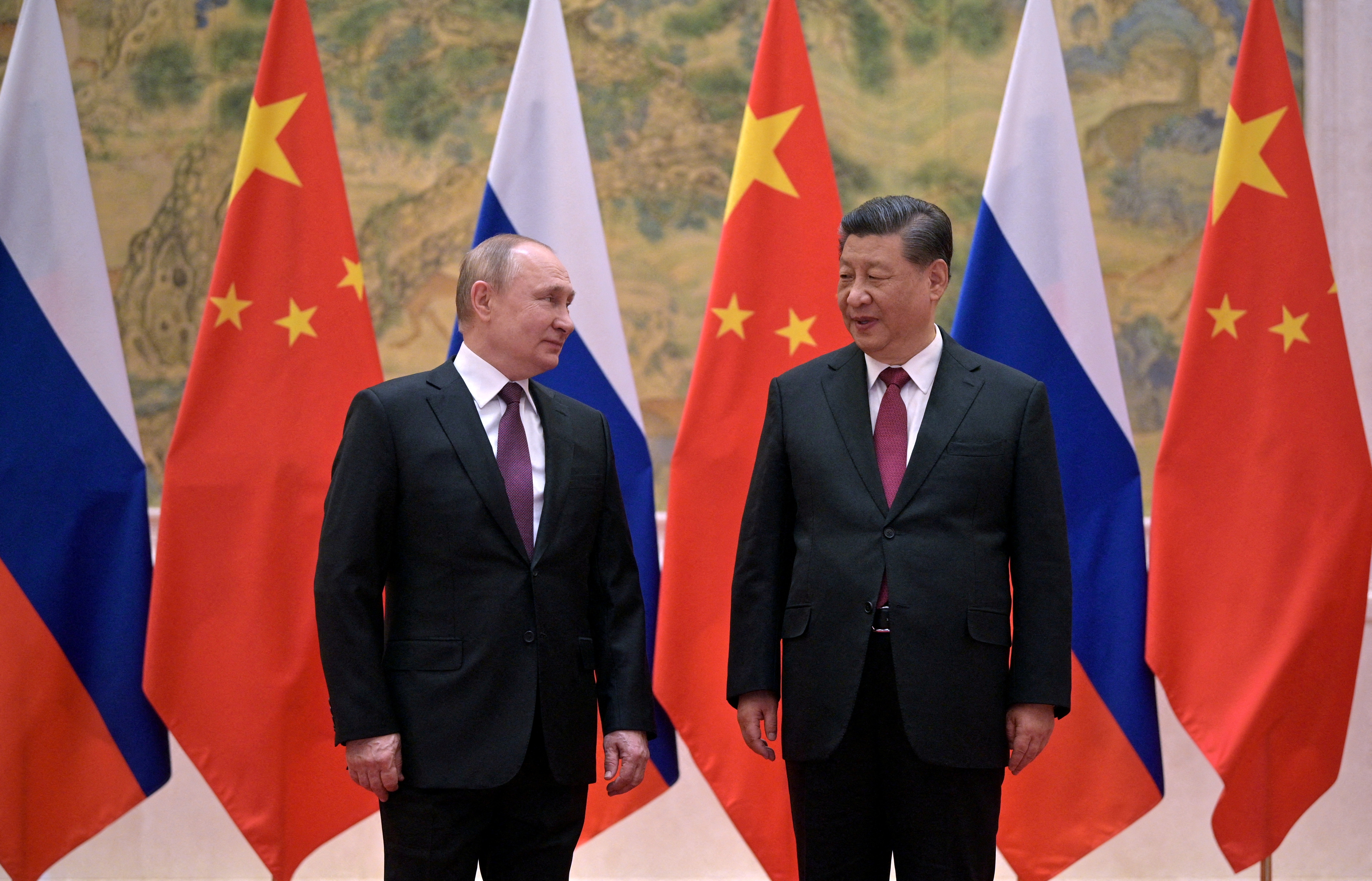 Russian President Vladimir Putin attends a meeting with Chinese President Xi Jinping in Beijing