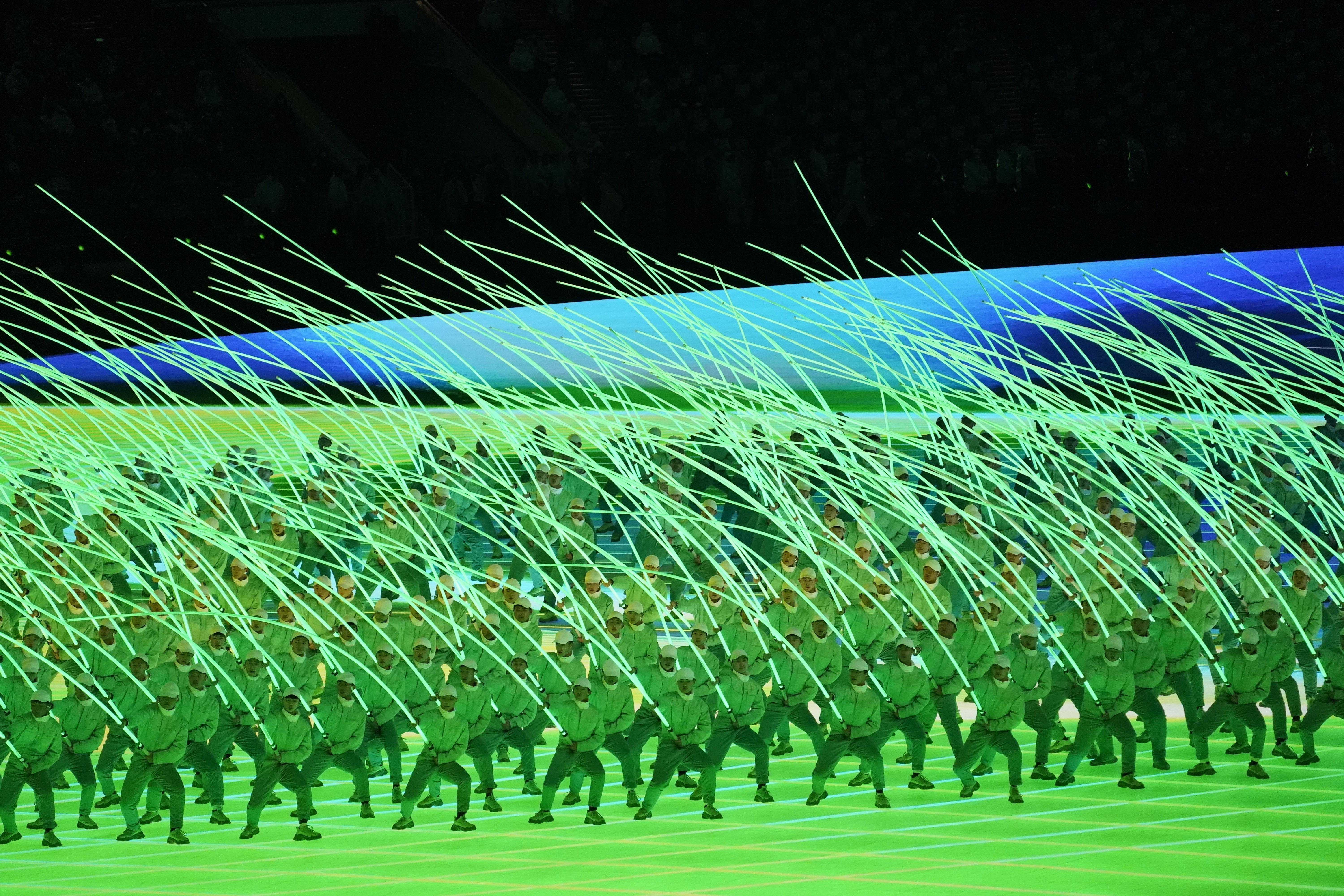 Performers dance during the Opening Ceremony of the Beijing 2022 Winter Olympic Games at Beijing National Stadium.