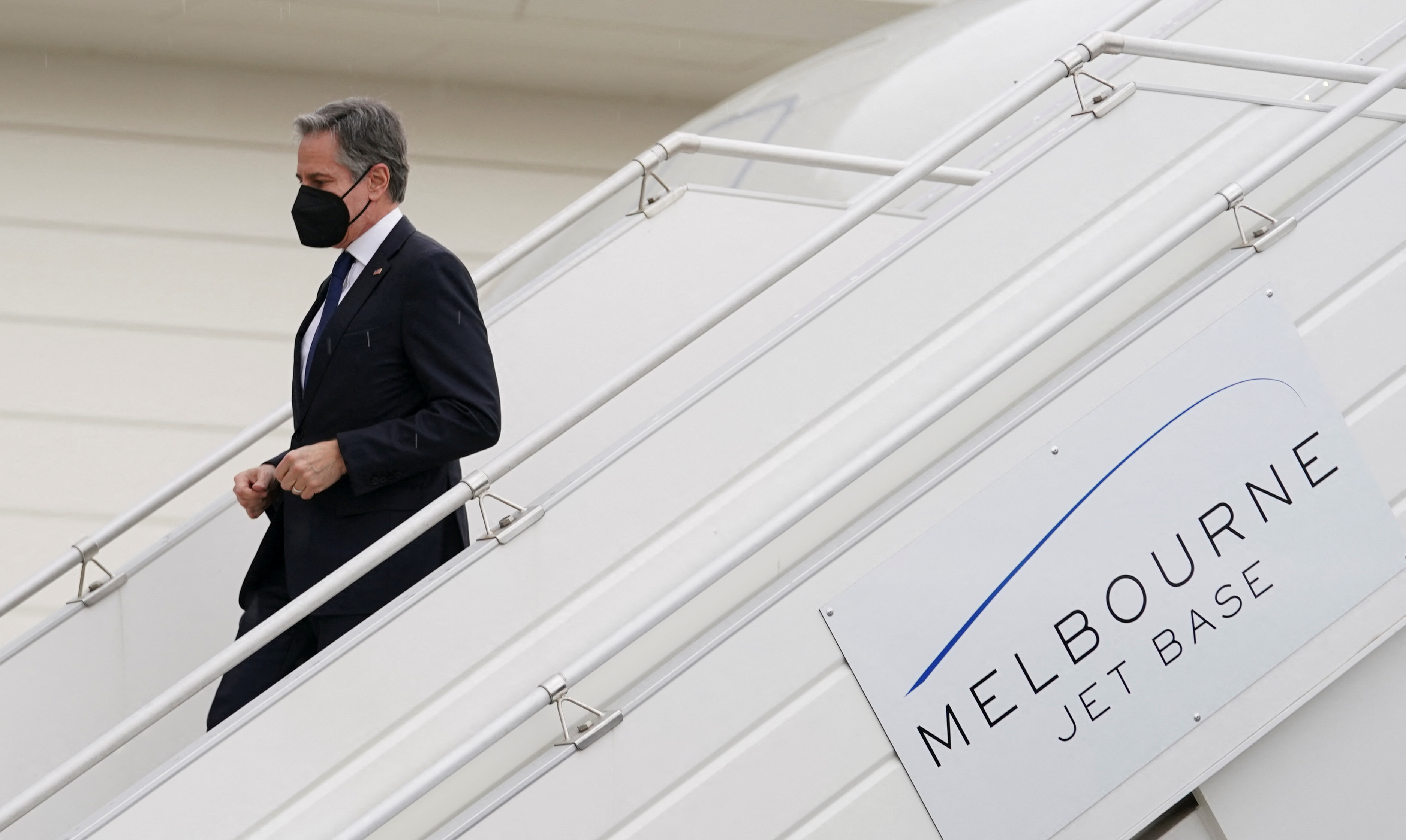 US Secretary of State Antony Blinken steps from his plane upon his arrival to attend the meeting of the Quadrilateral Security Dialogue (Quad) foreign ministers in Melbourne, Australia, February 9, 2022.