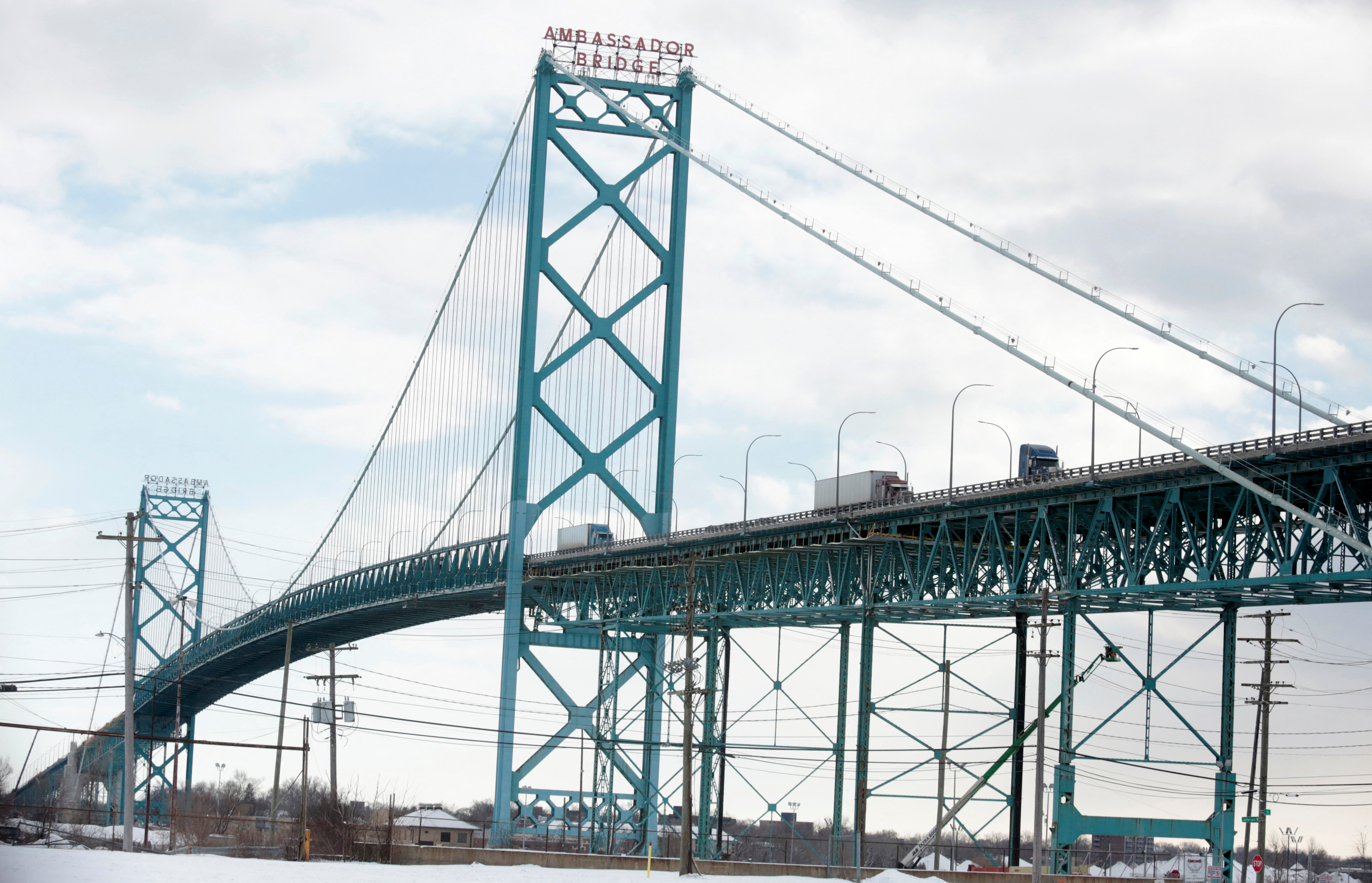 Commercial trucks cross the Ambassador Bridge from Canada to Detroit