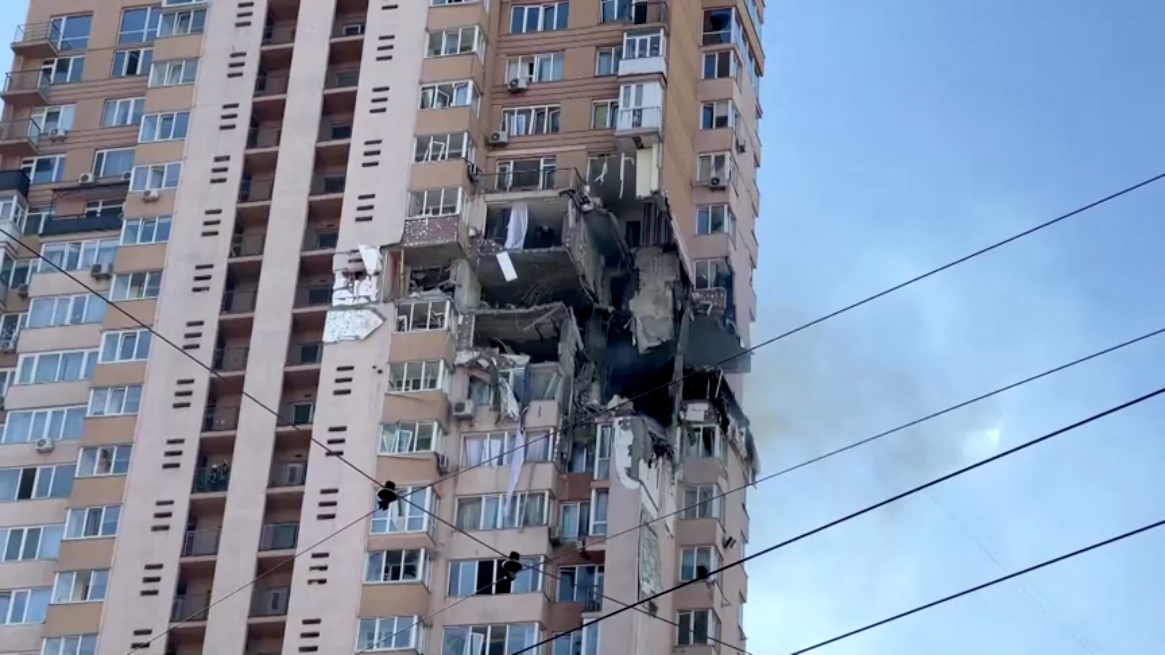 A screengrab from a video shows a damaged multi-storey residential building in an aftermath of shelling, after Russia launched a massive military operation against Ukraine, in south-west of Kyiv, Ukraine